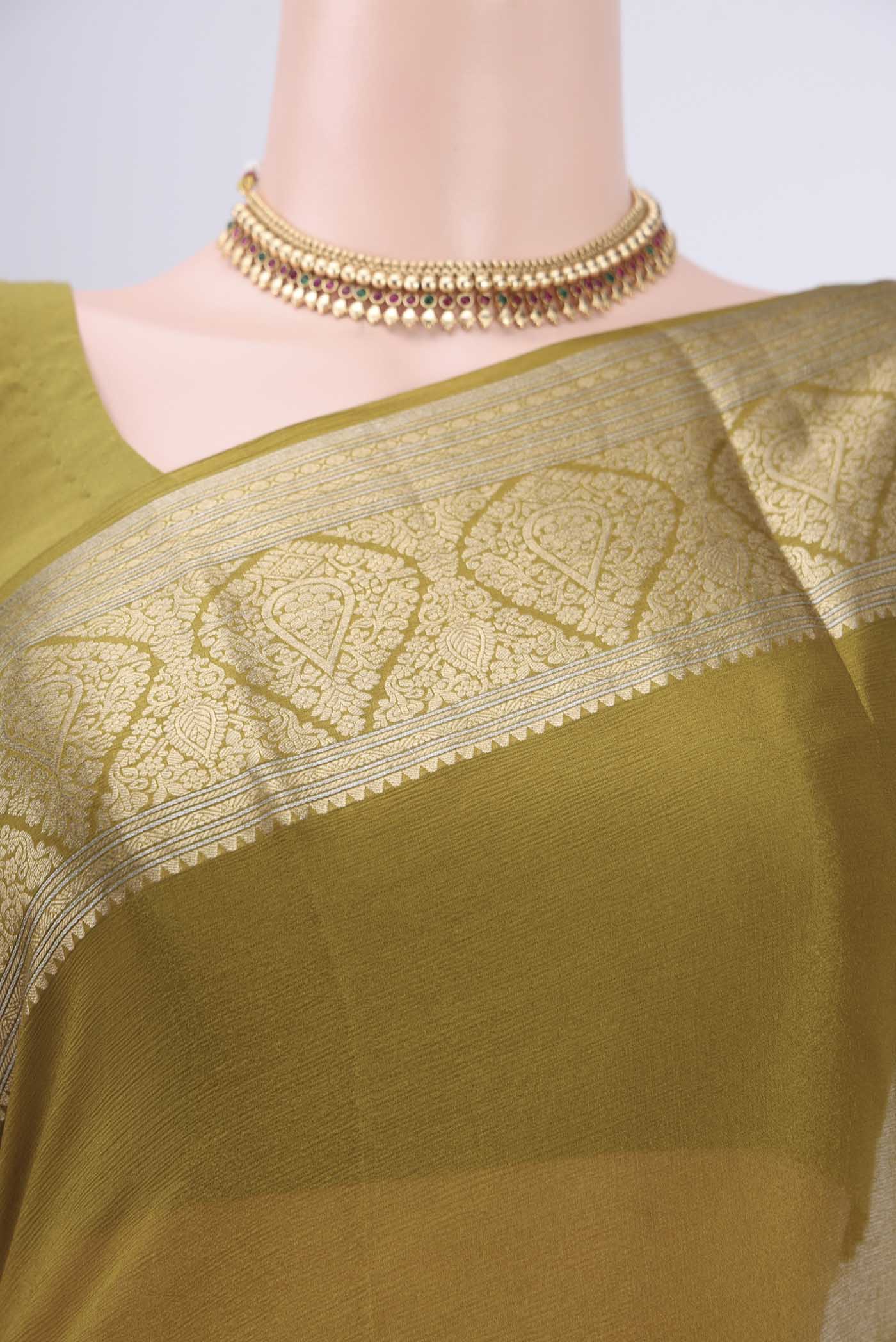 Border image of Mehandi Green Mysore Chiffon Saree with Plain Body and Zari Border. 