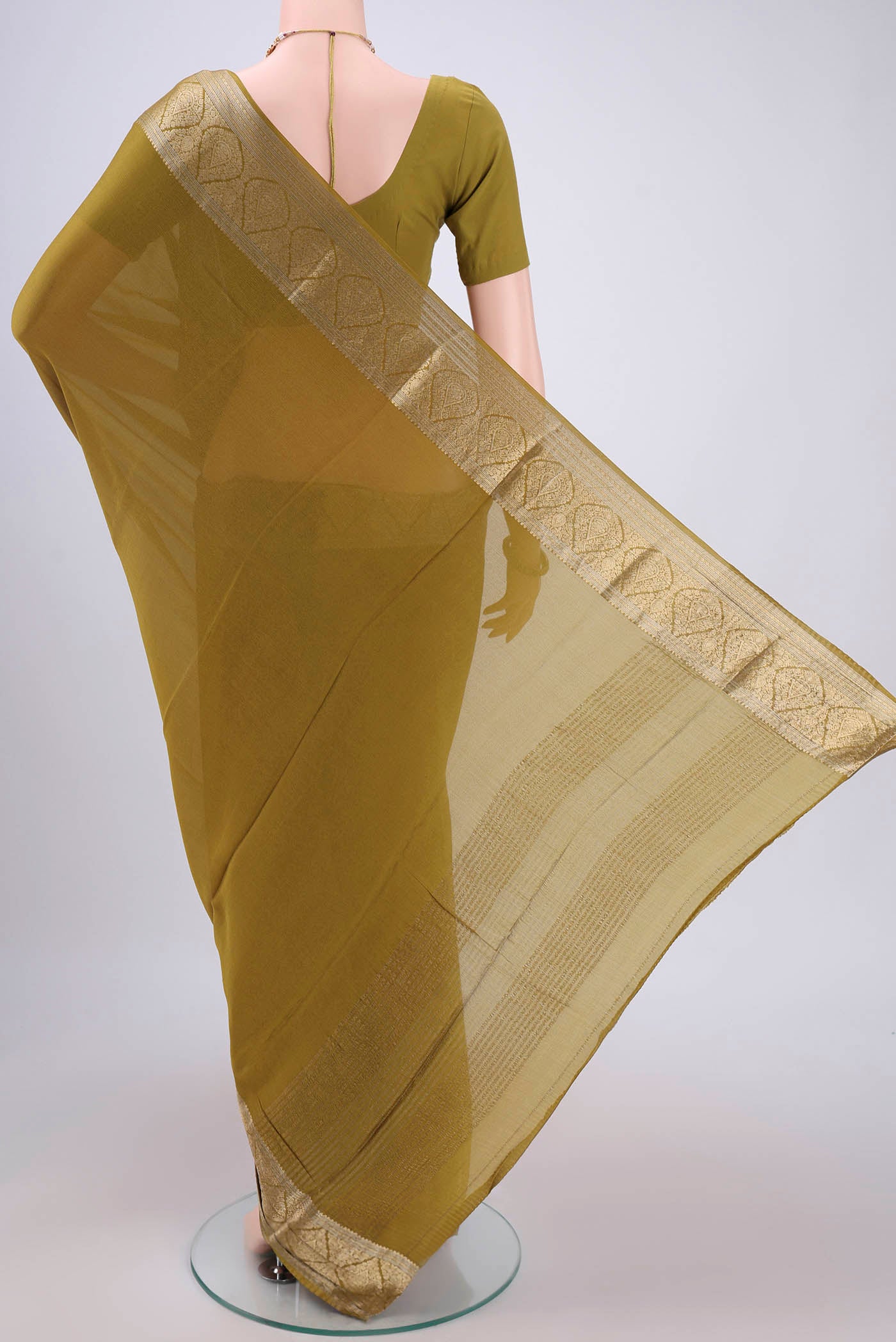 Flat view of Mehandi Green Mysore Chiffon Saree with Plain Body and Zari Border. 