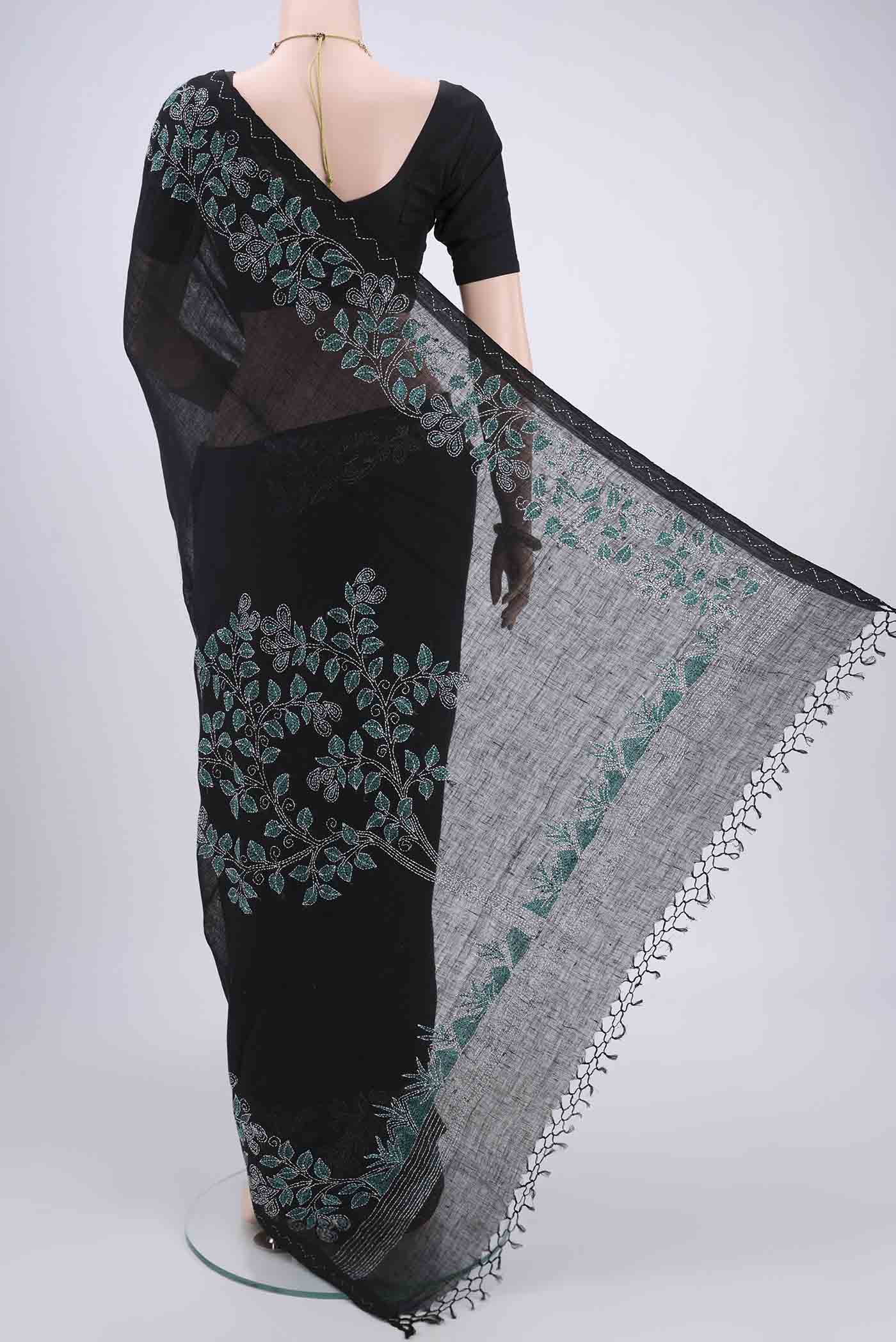 Flat view of Blue Linen Saree with Kantha Work on the body and Plain Border. 