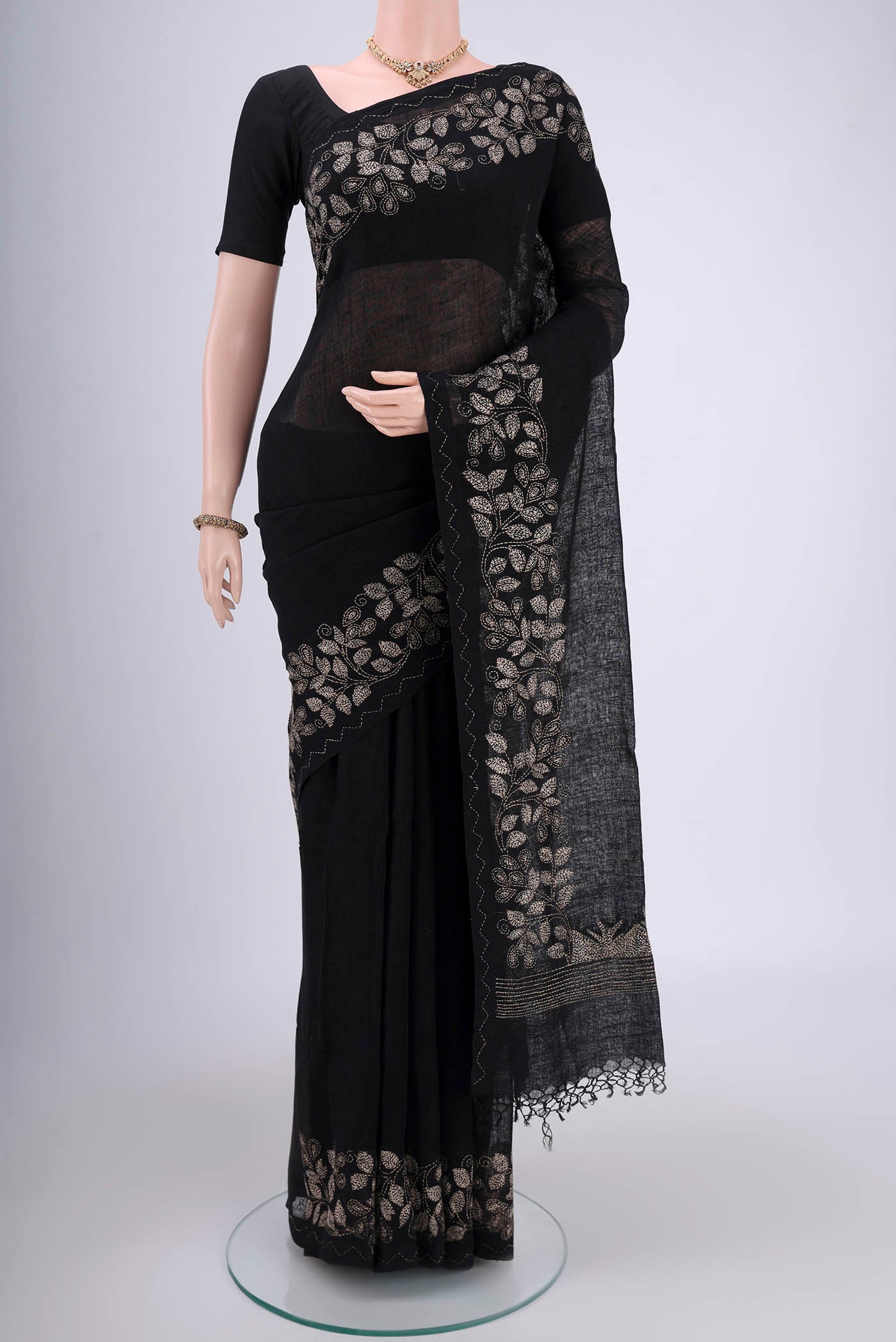 Blue Linen Saree with Kantha Work on the body and Plain Border.  displayed on a mannequin