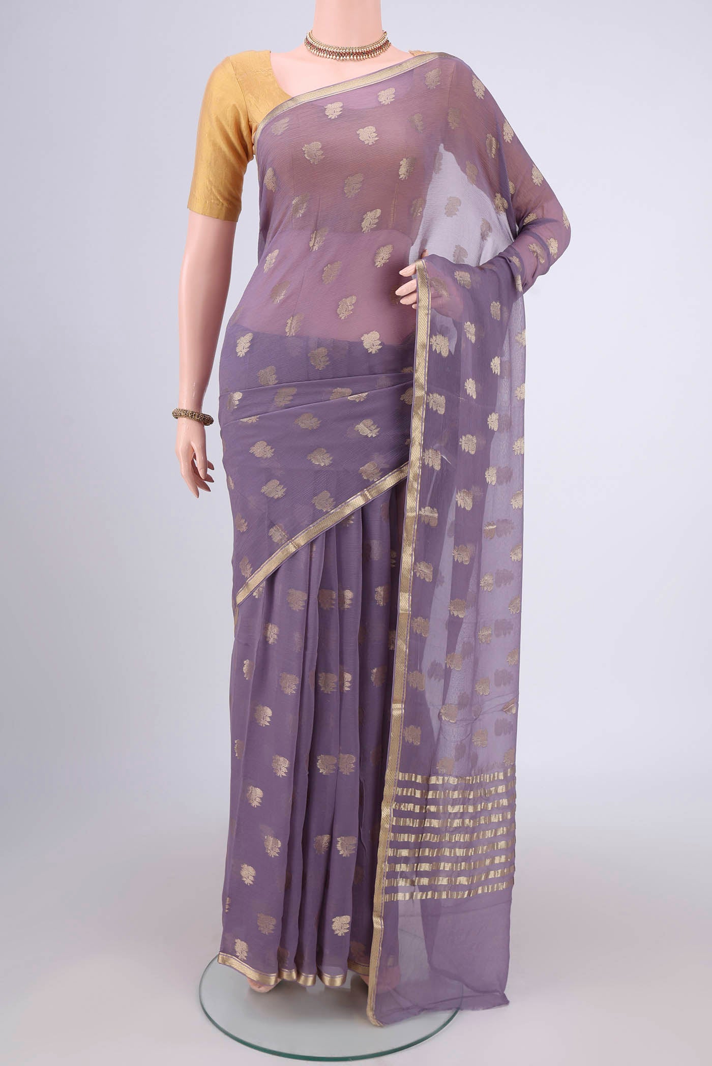 Lavender Mysore Chiffon Saree with Zari Butta on the body and Zari Border.  displayed on a mannequin