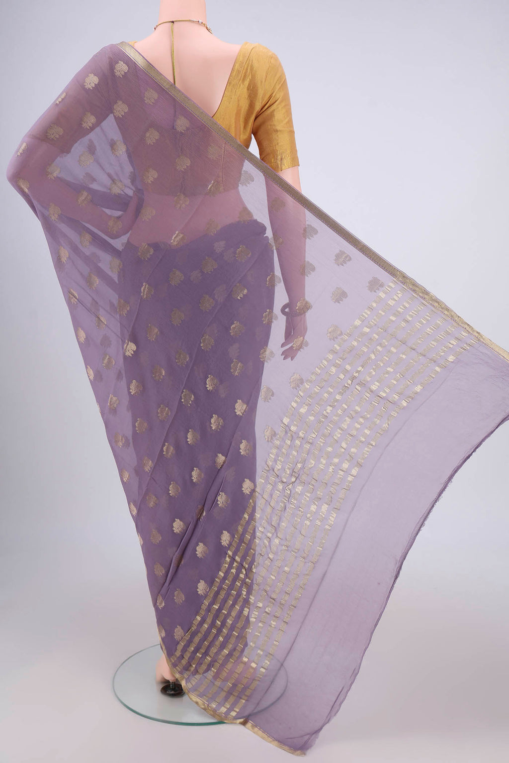 Flat view of Lavender Mysore Chiffon Saree with Zari Butta on the body and Zari Border. 