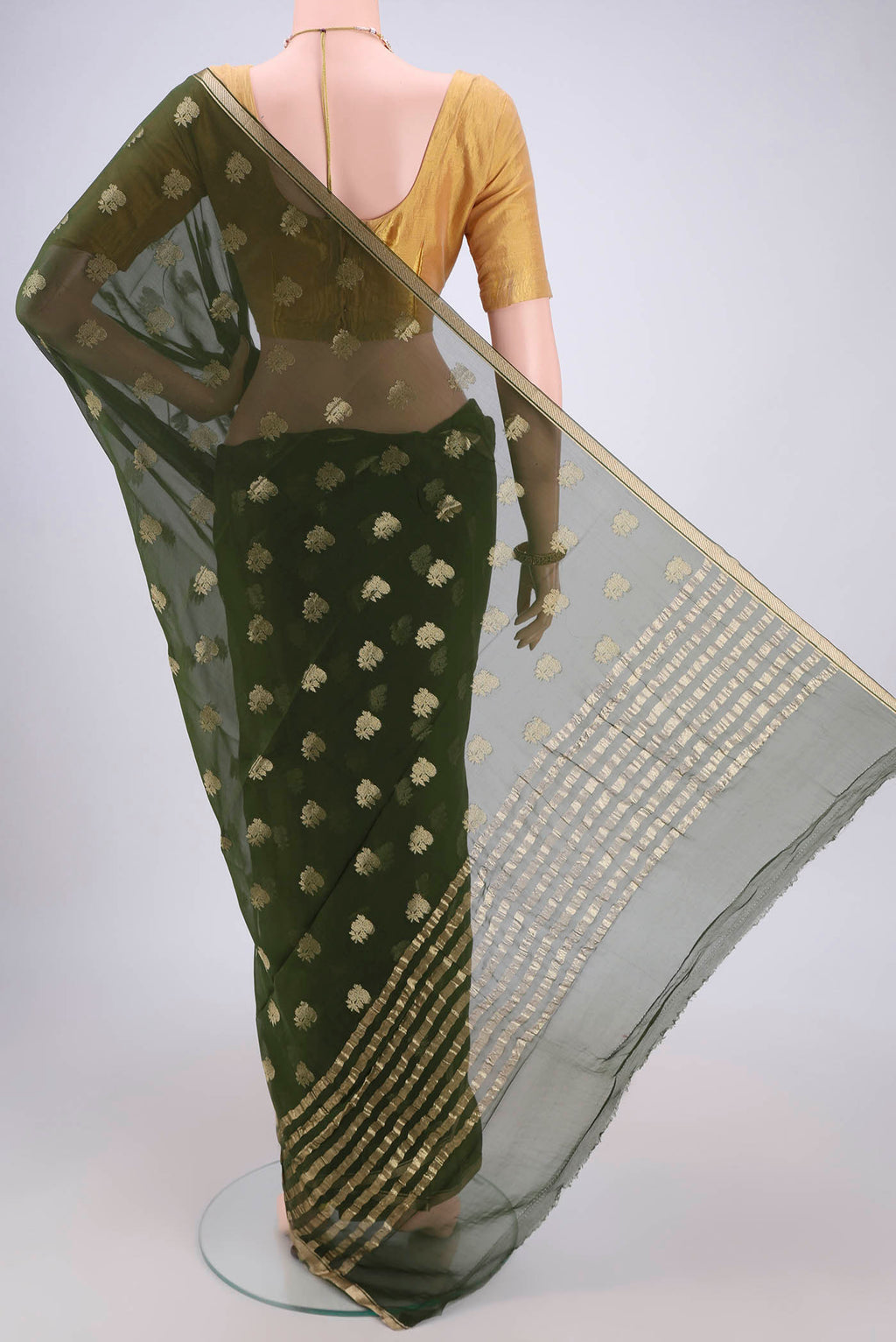 Flat view of Olive Green Mysore Chiffon Saree with Zari Butta on the body and Zari Border. 