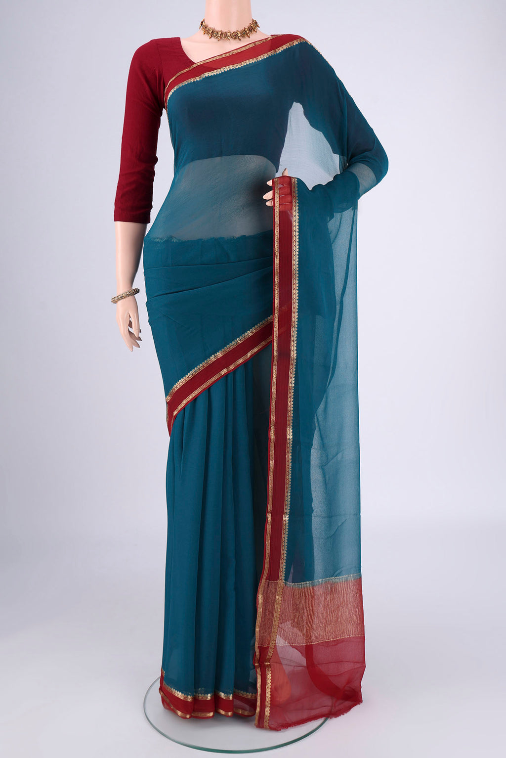 Blue Mysore Chiffon Saree with Plain Body and Zari Border.  displayed on a mannequin