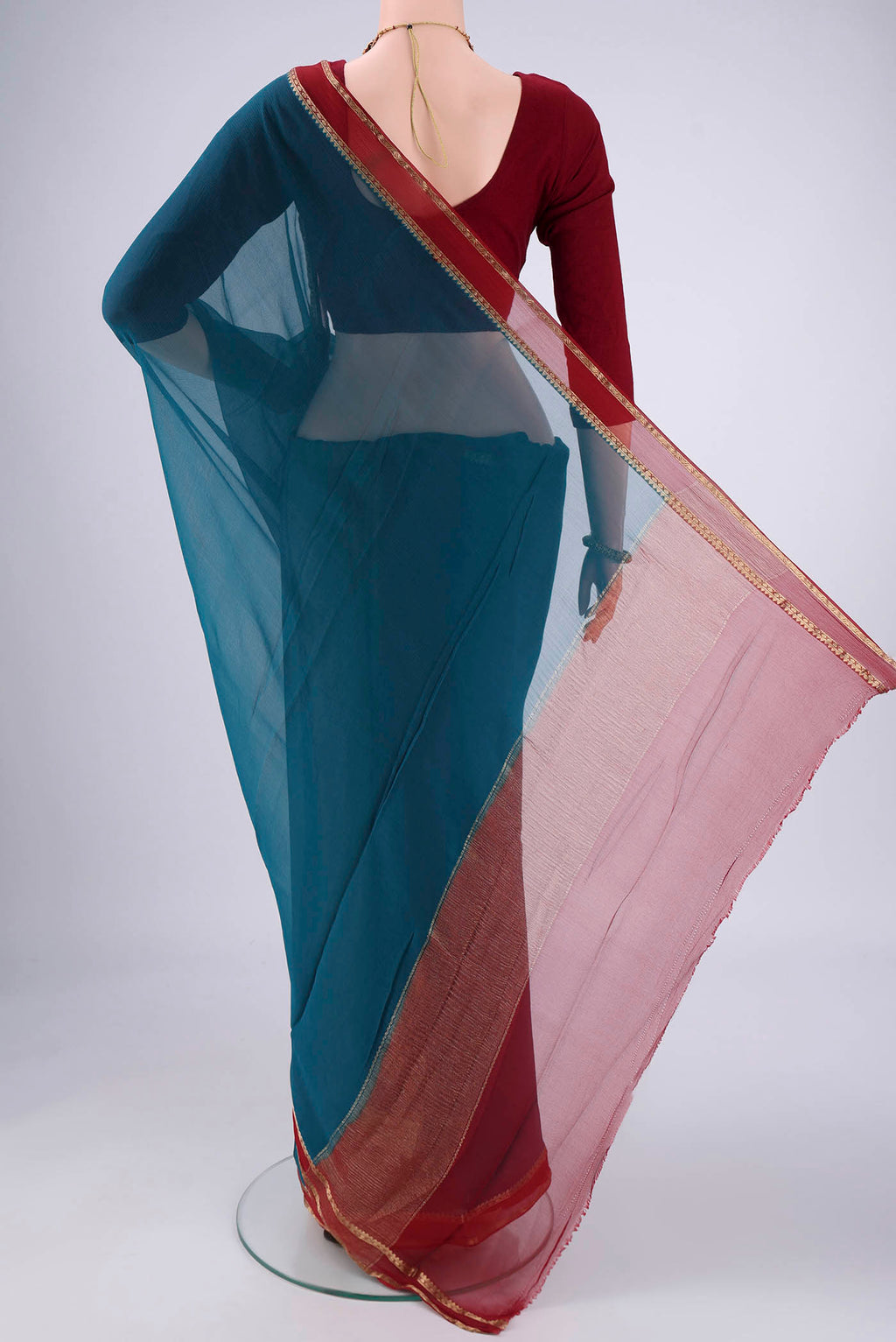 Flat view of Blue Mysore Chiffon Saree with Plain Body and Zari Border. 