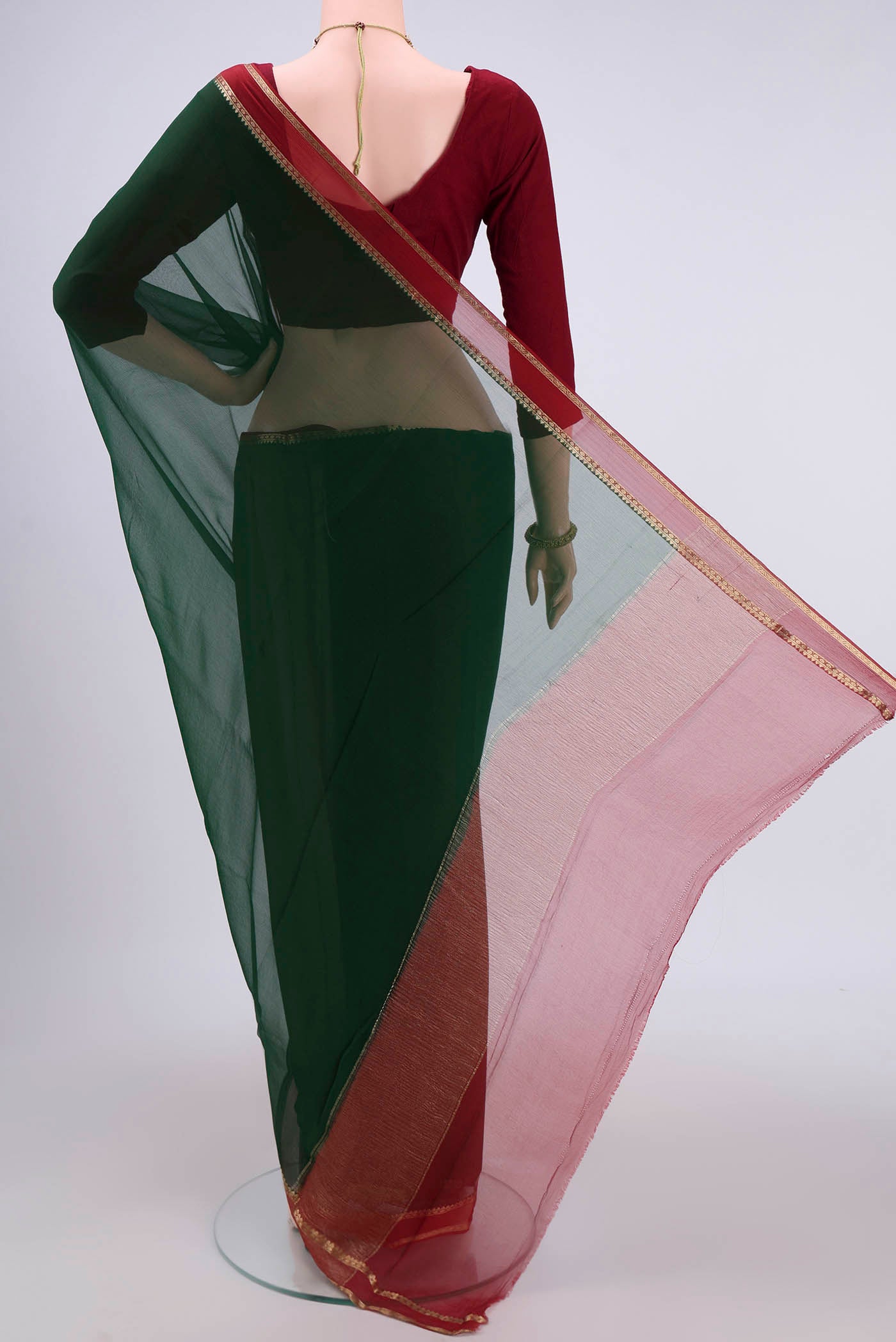 Flat view of Bottle Green Dual Tone Mysore Chiffon Saree with Plain Body and Zari Border. 