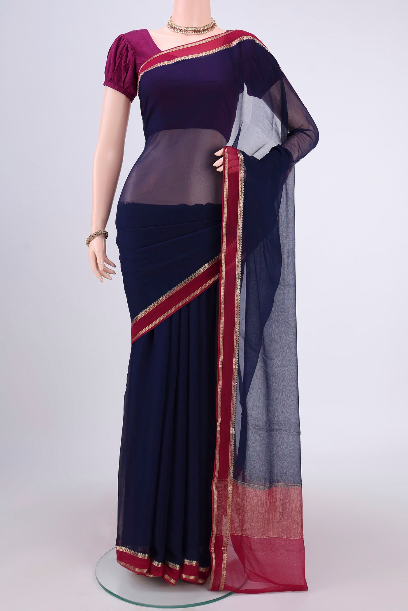 Navy Blue Mysore Chiffon Saree with Plain Body and Zari Border.  displayed on a mannequin