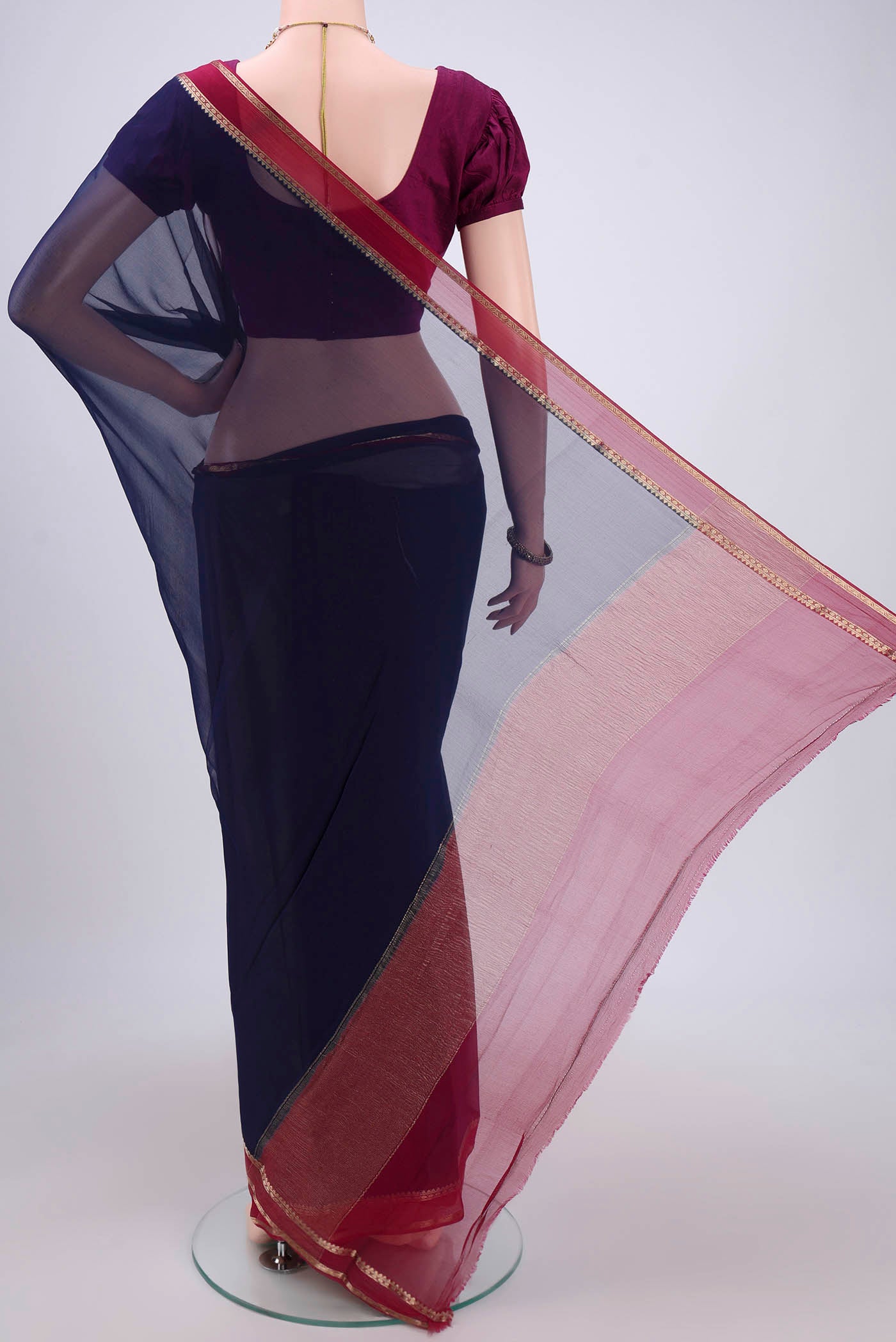 Flat view of Navy Blue Mysore Chiffon Saree with Plain Body and Zari Border. 