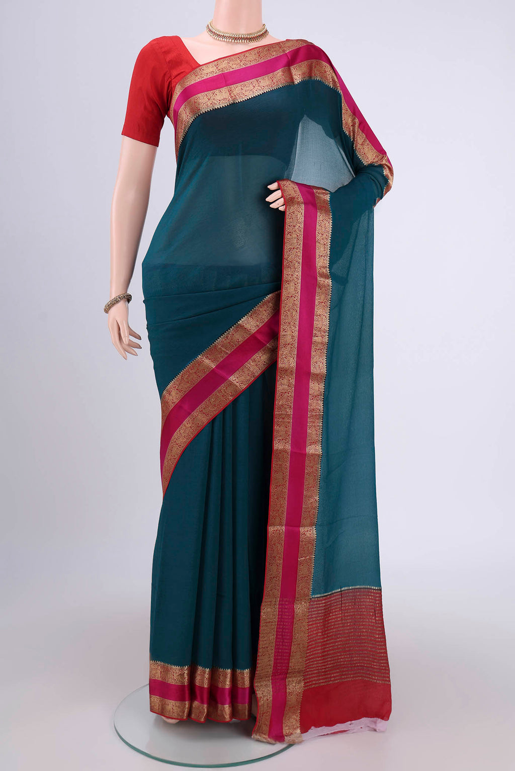 Turquoise Dual Tone Mysore Chiffon Saree with Plain Body and Zari Border.  displayed on a mannequin