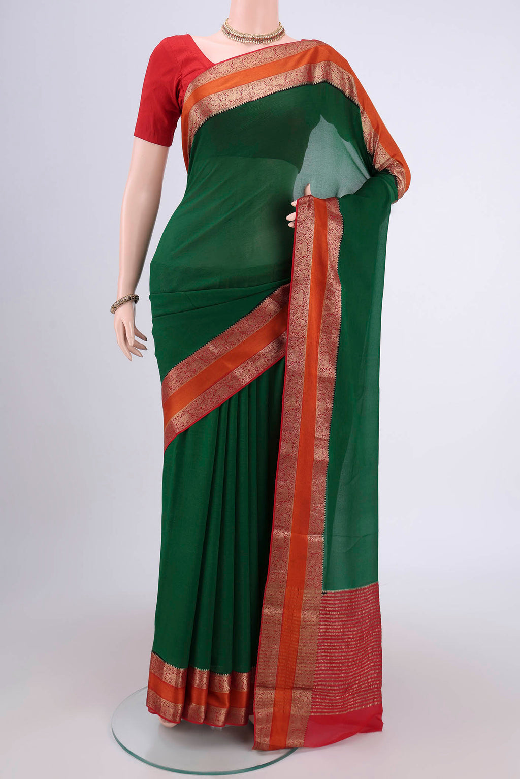 Green Mysore Chiffon Saree with Plain Body and Zari Border.  displayed on a mannequin