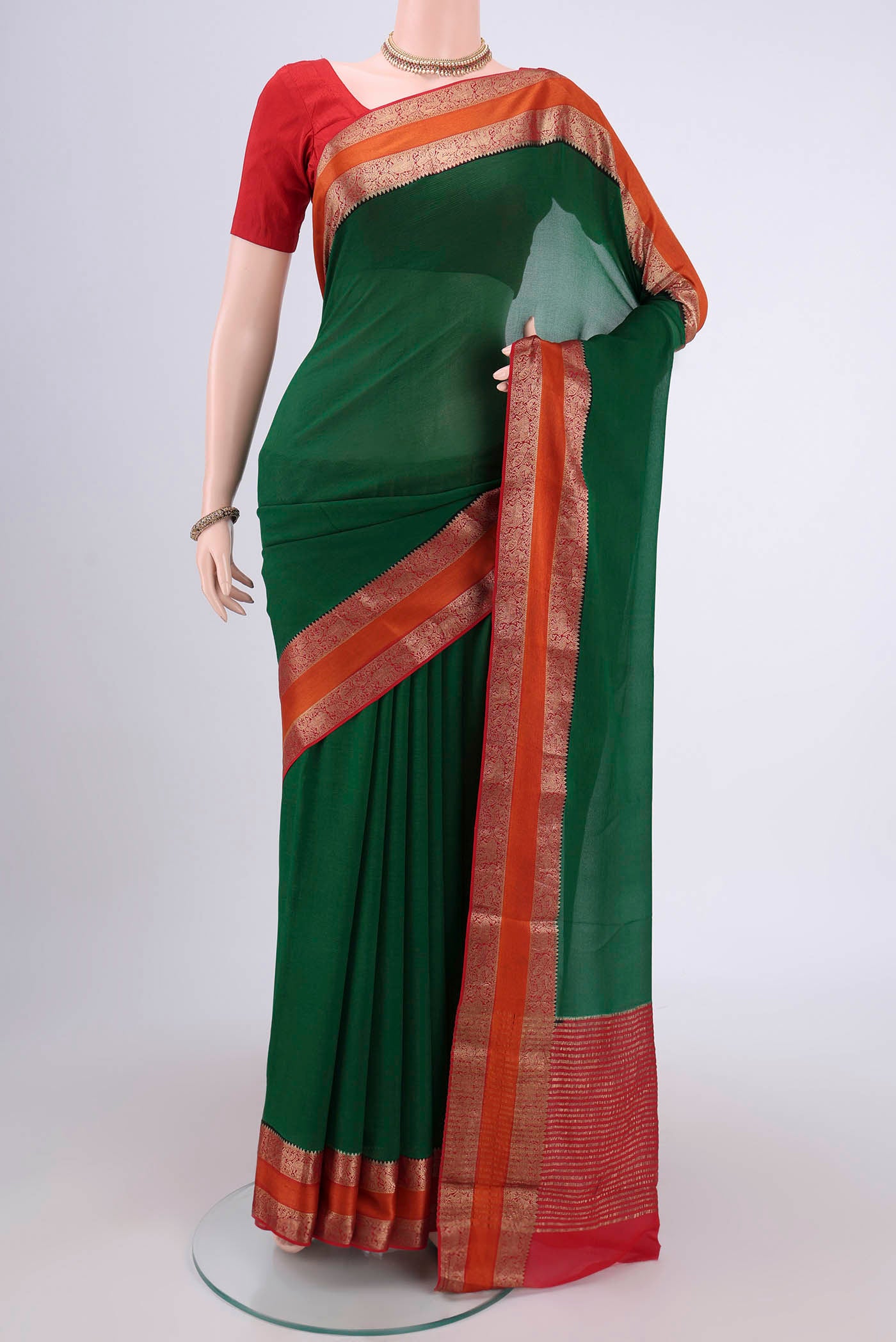 Green Mysore Chiffon Saree with Plain Body and Zari Border.  displayed on a mannequin
