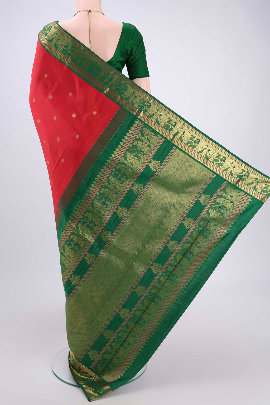 Flat view of Red Dual Tone Kanjivaram Silk Saree with Zari Butta on the body and Zari Border. 