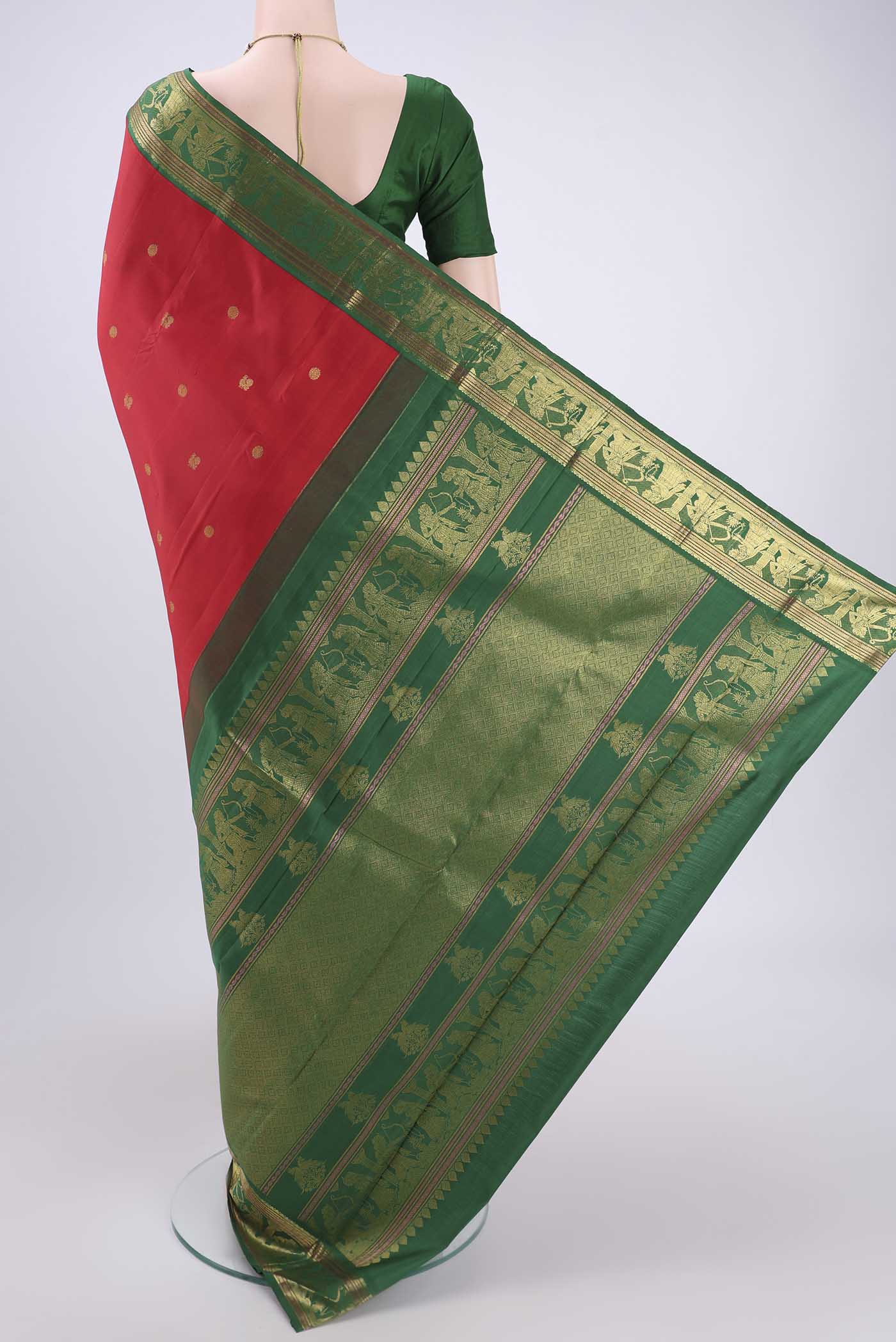 Flat view of Red Dual Tone Kanjivaram Silk Saree with Zari Butta on the body and Zari Border. 