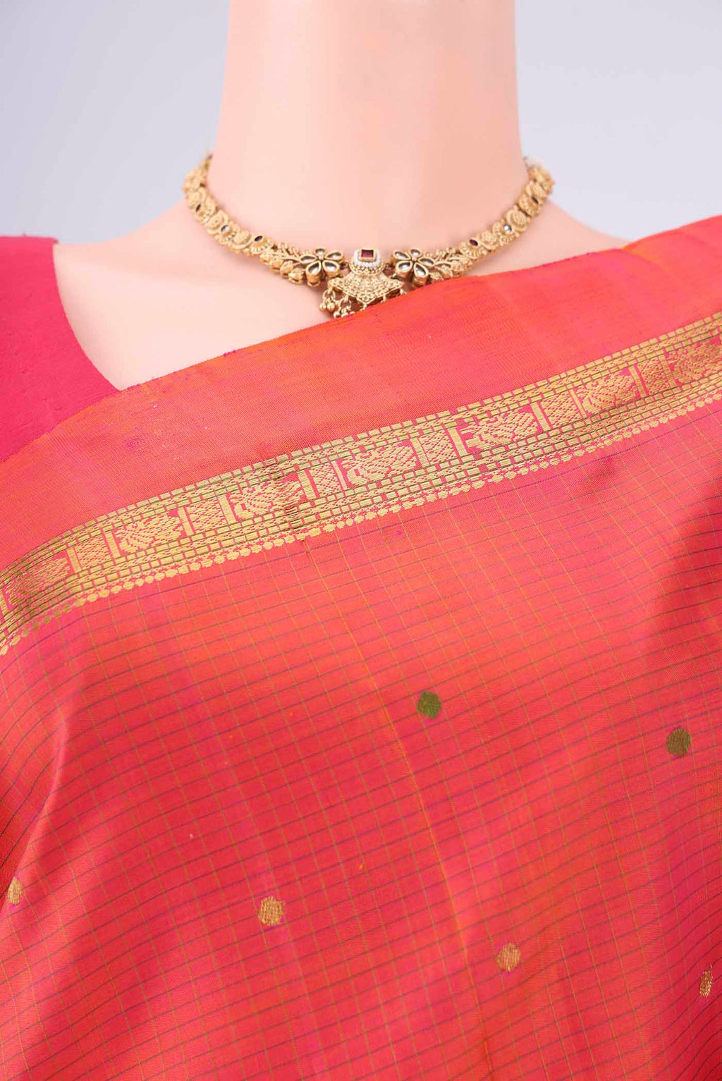 Border image of Brick Orange Kanjivaram Silk Saree with Zari And Thread Butta on the body and Zari Border. 