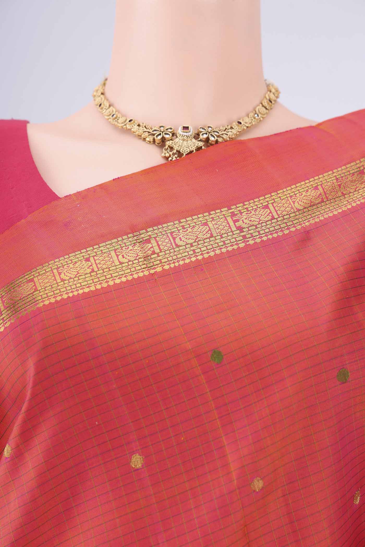 Border image of Brick Orange Kanjivaram Silk Saree with Zari And Thread Butta on the body and Zari Border. 