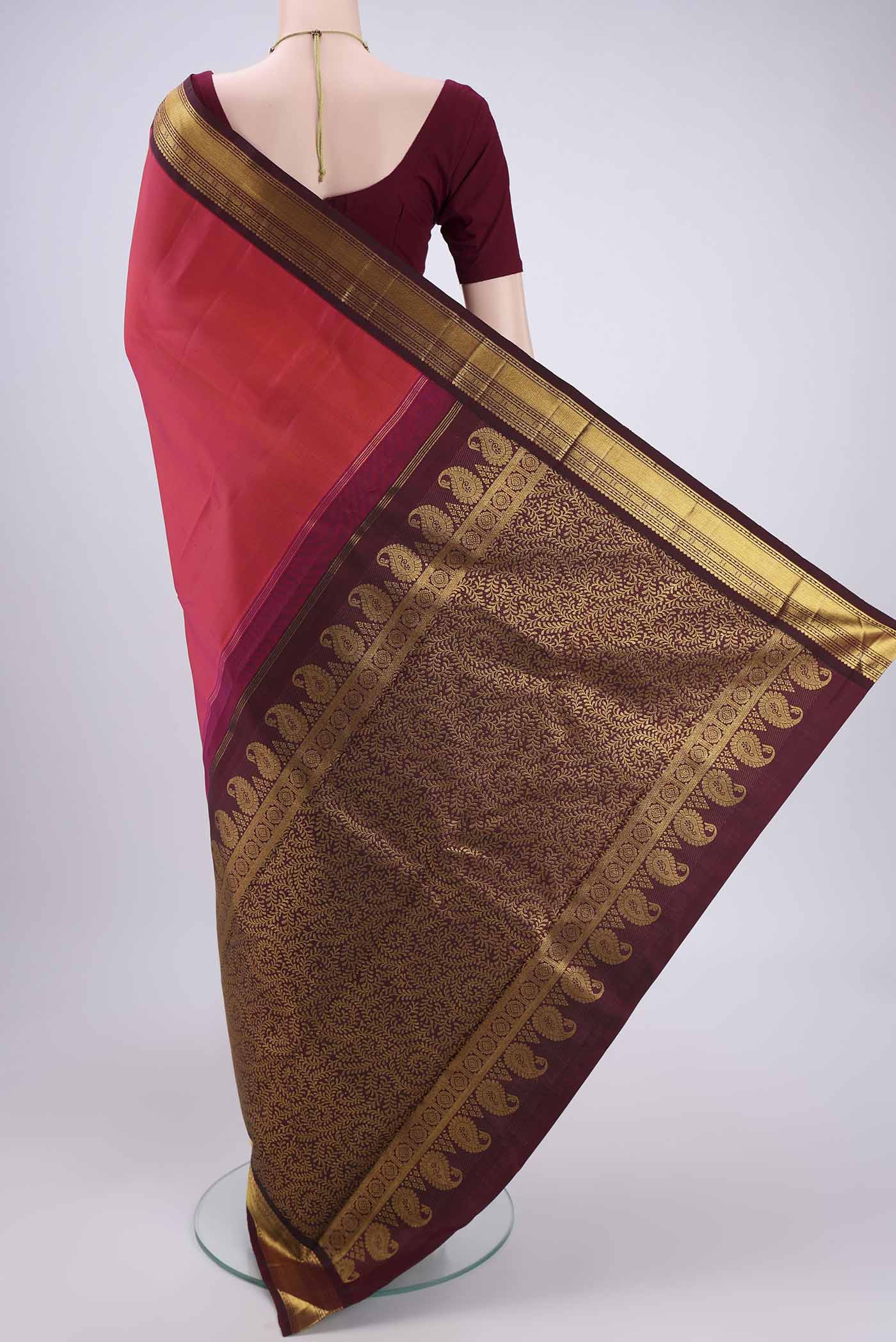Flat view of Dark Pink Kanchipuram Silk Saree with Plain Body and Zari Border. 