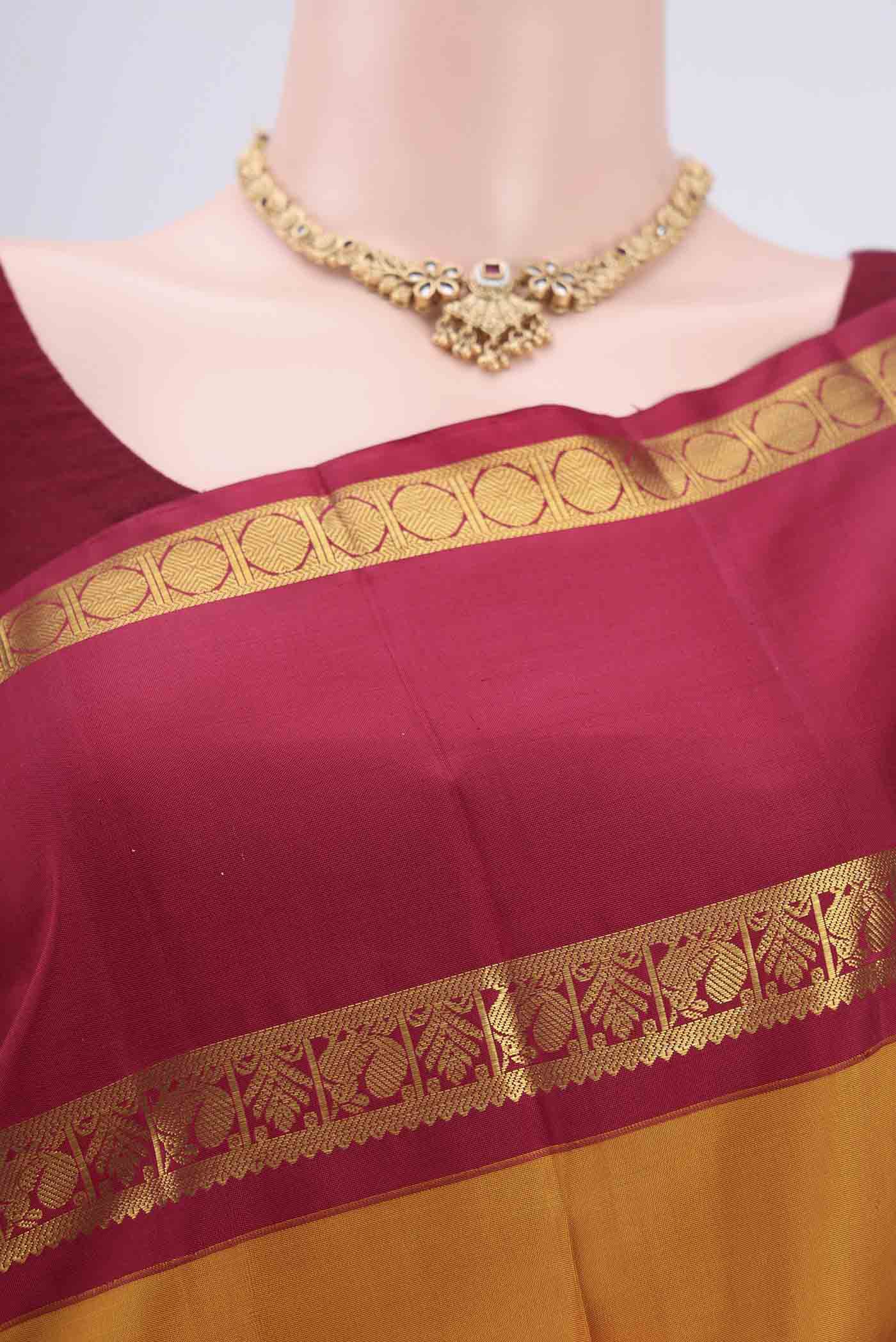 Border image of Mustard Kanchipuram Silk Saree with Plain Body and Zari Border. 