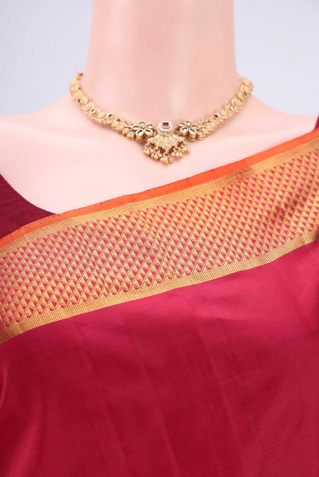 Border image of Maroon Kanchipuram Silk Saree with Plain Body and Zari Border. 