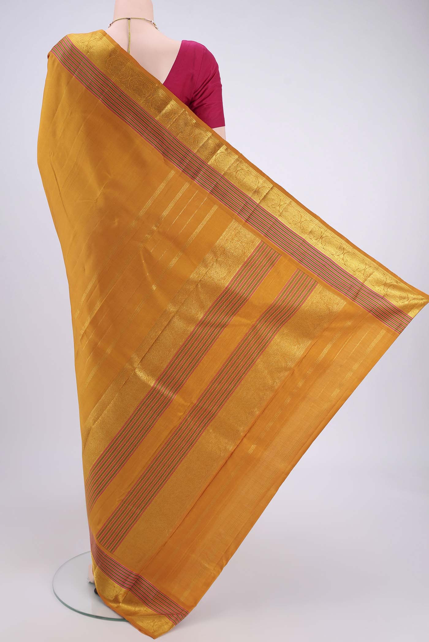 Flat view of Mustard Kanchipuram Silk Saree with Plain Body and Zari And Thread Border. 
