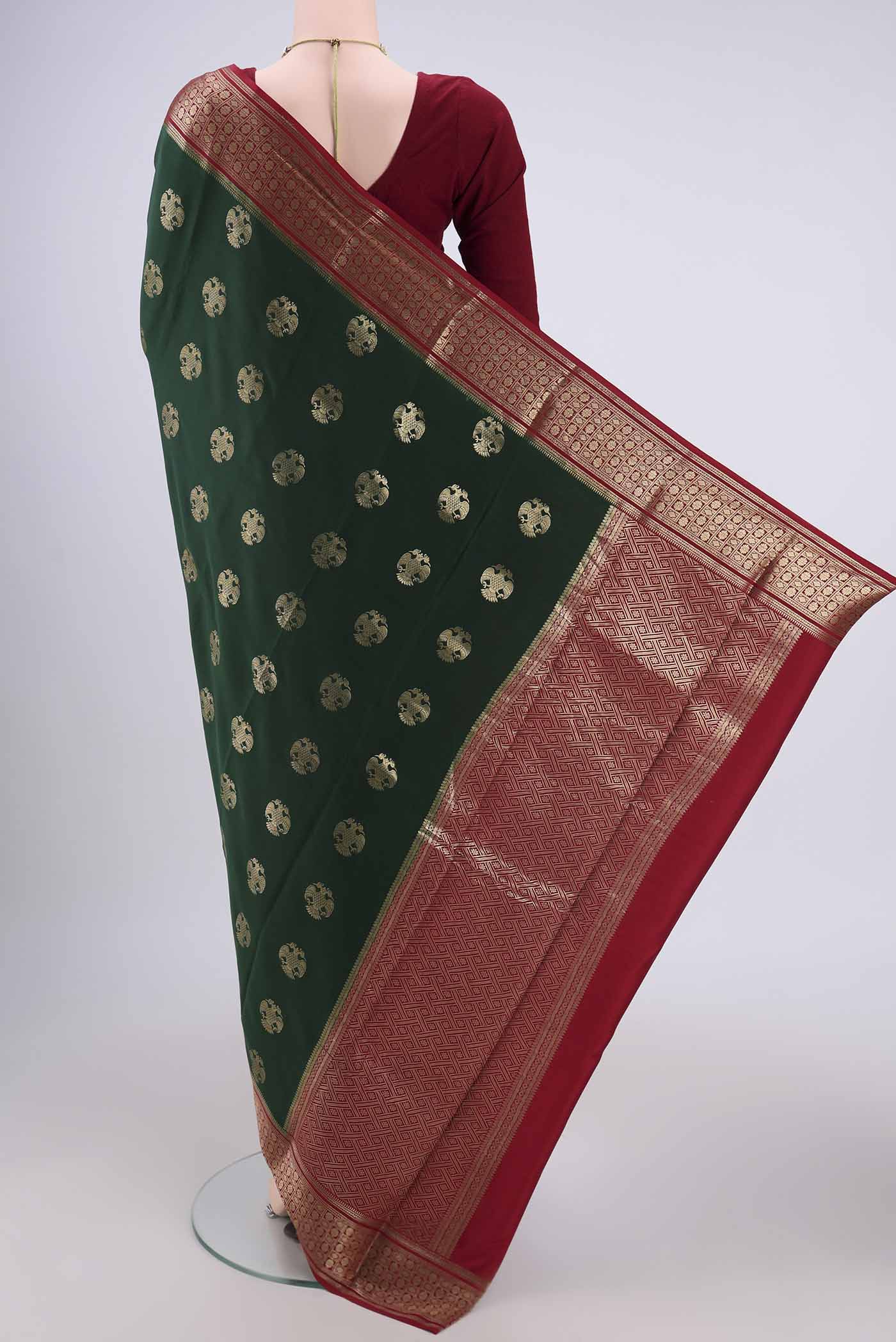 Flat view of Bottle Green Mysore Crepe Saree with Jacquard design on the body and Zari Border. 