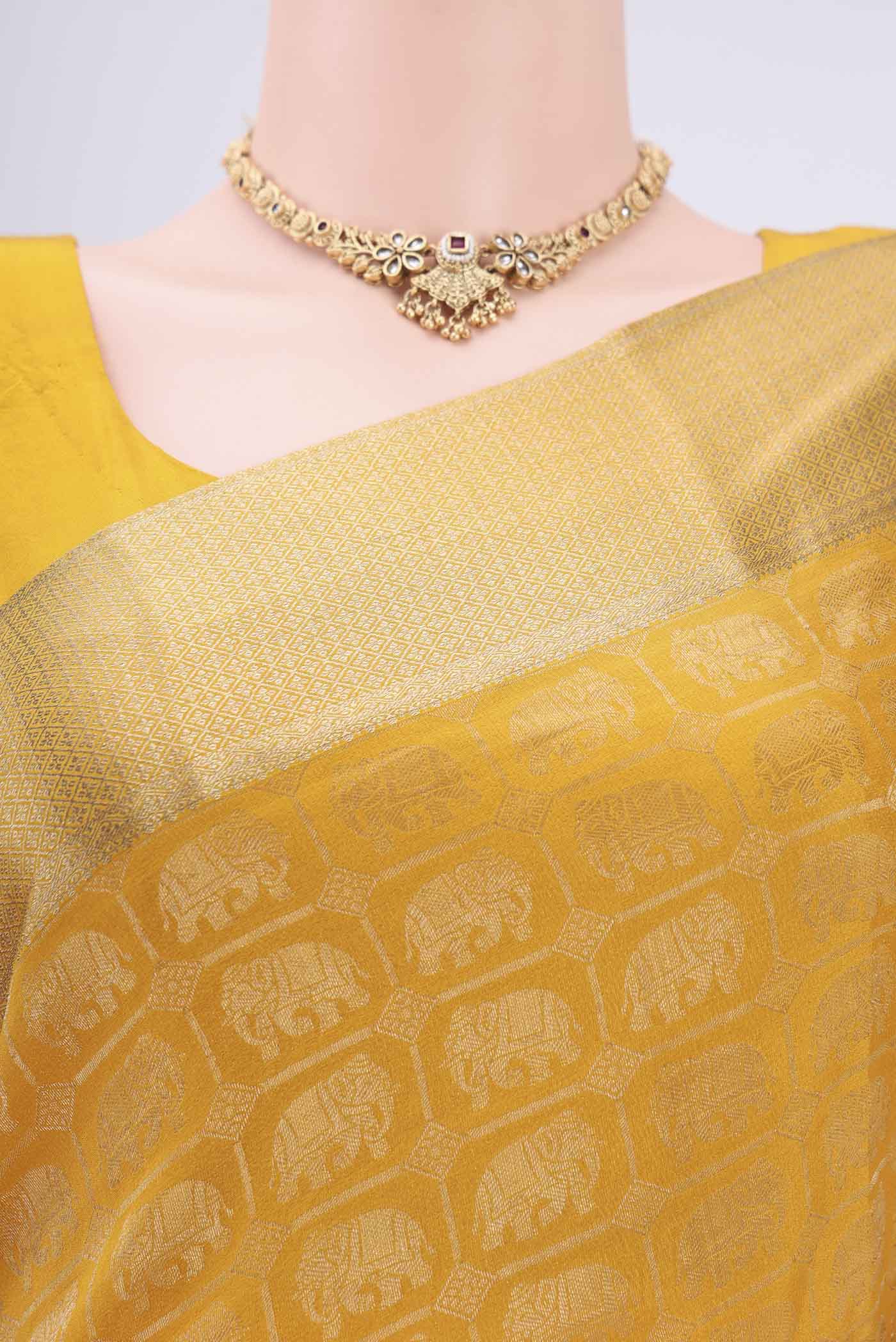 Border image of Mustard Mysore Crepe Saree with Zari Brocade on the body and Zari Border. 