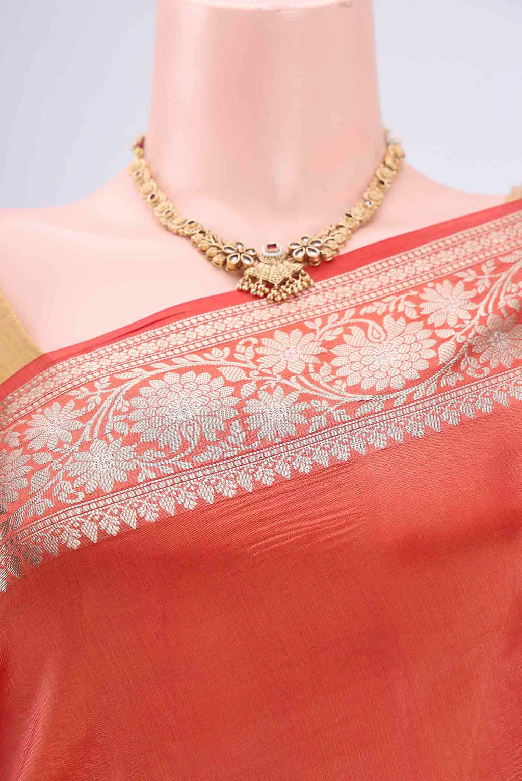 Border image of Brick Orange Banarasi Raw Silk Saree with Zari Butta on the body and Zari Border. 