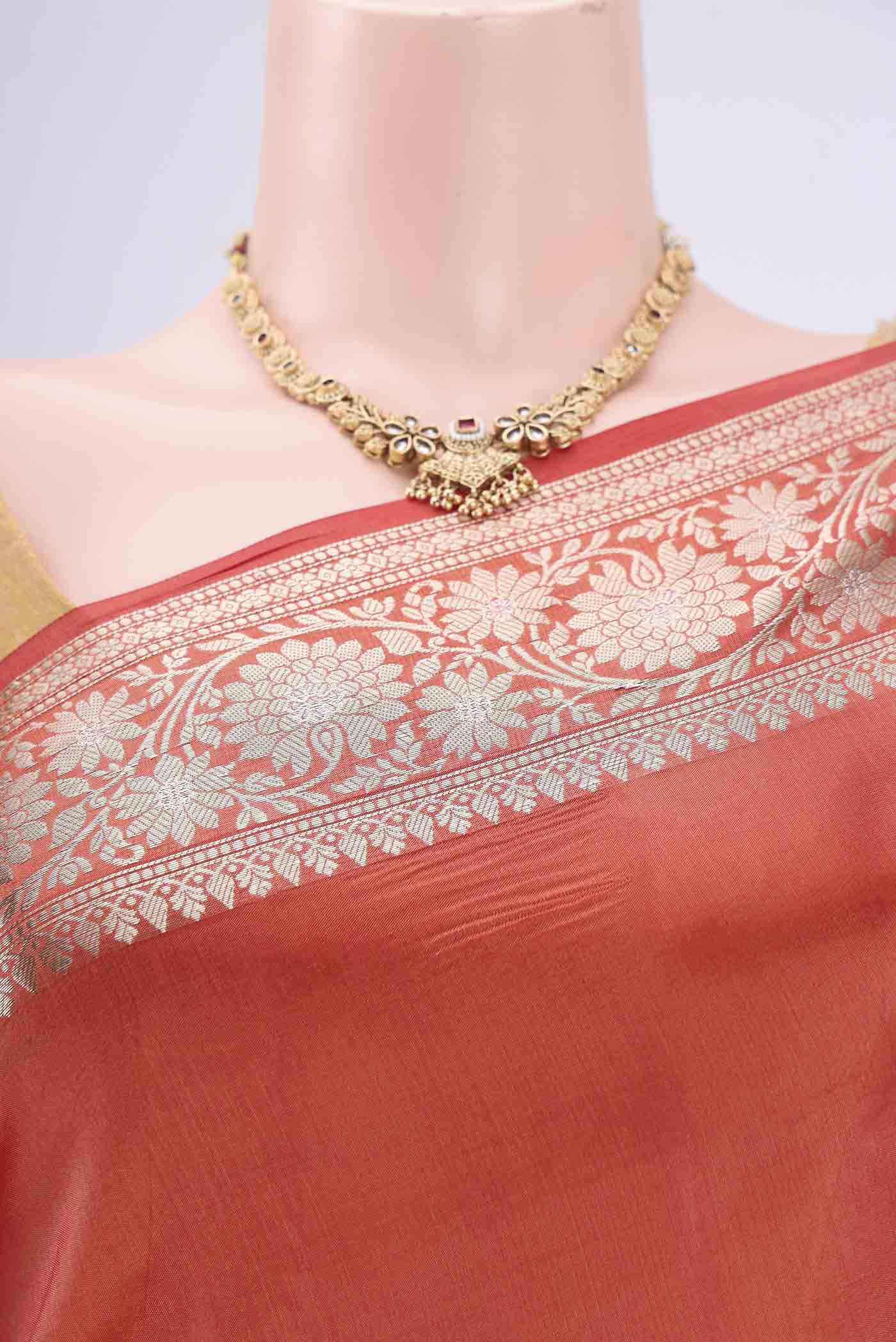 Border image of Brick Orange Banarasi Raw Silk Saree with Zari Butta on the body and Zari Border. 
