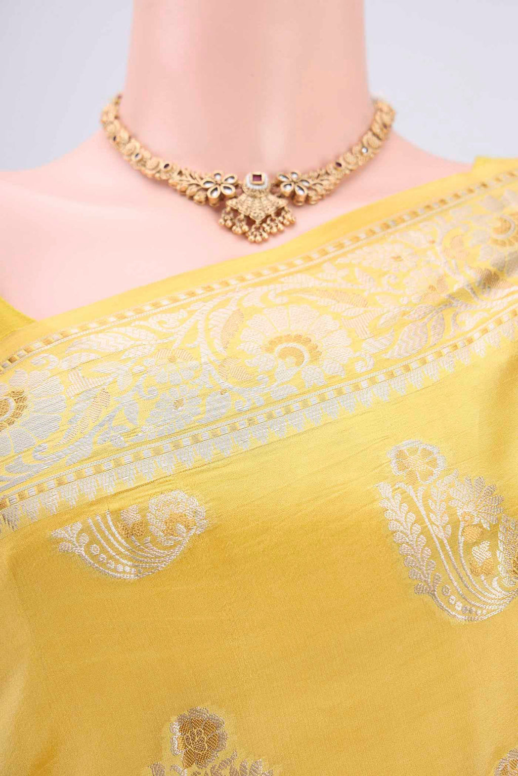 Border image of Yellow Banarasi Raw Silk Saree with Zari Butta on the body and Zari Border. 