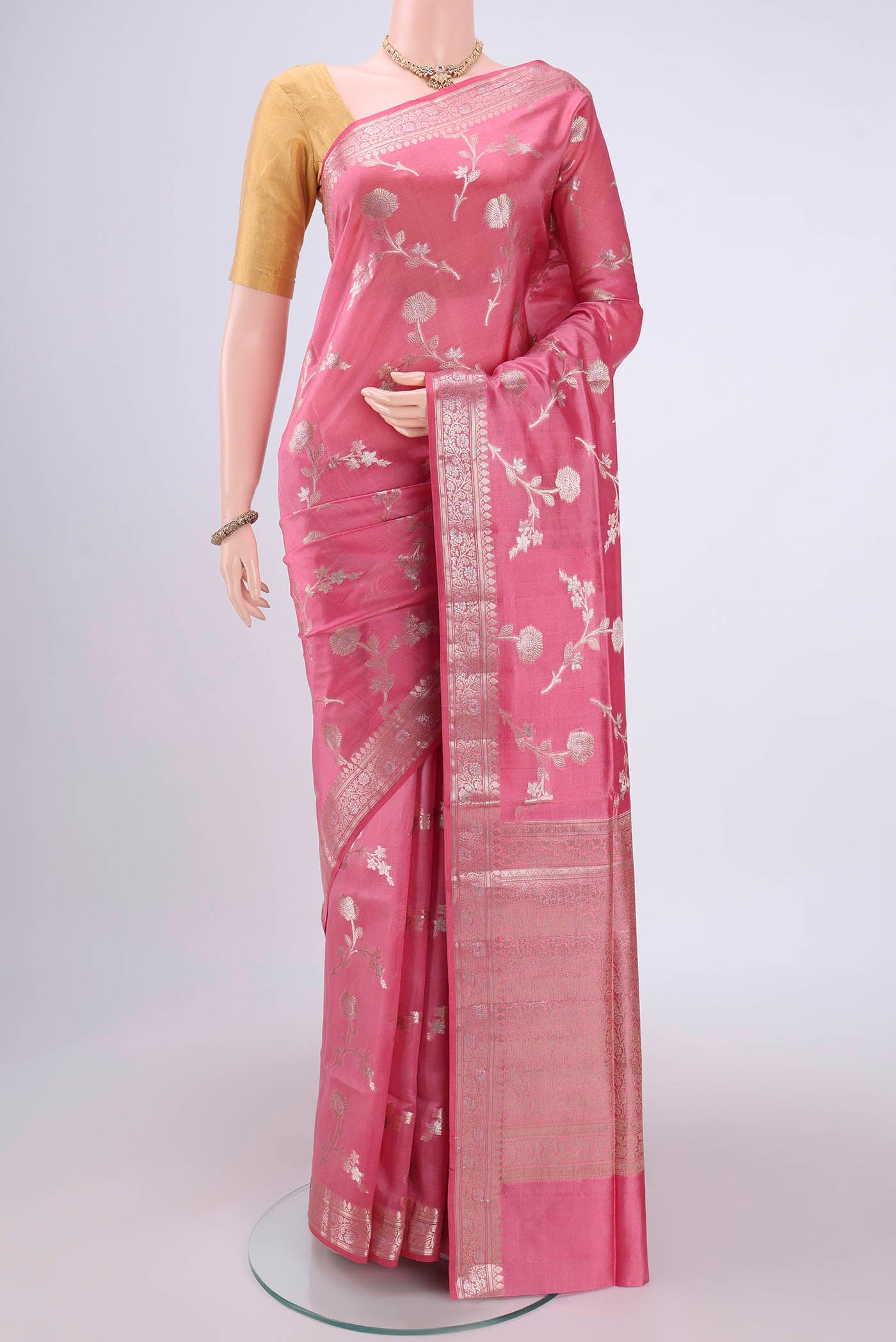Peach Banarasi Raw Silk Saree with Zari Brocade on the body and Zari Border.  displayed on a mannequin