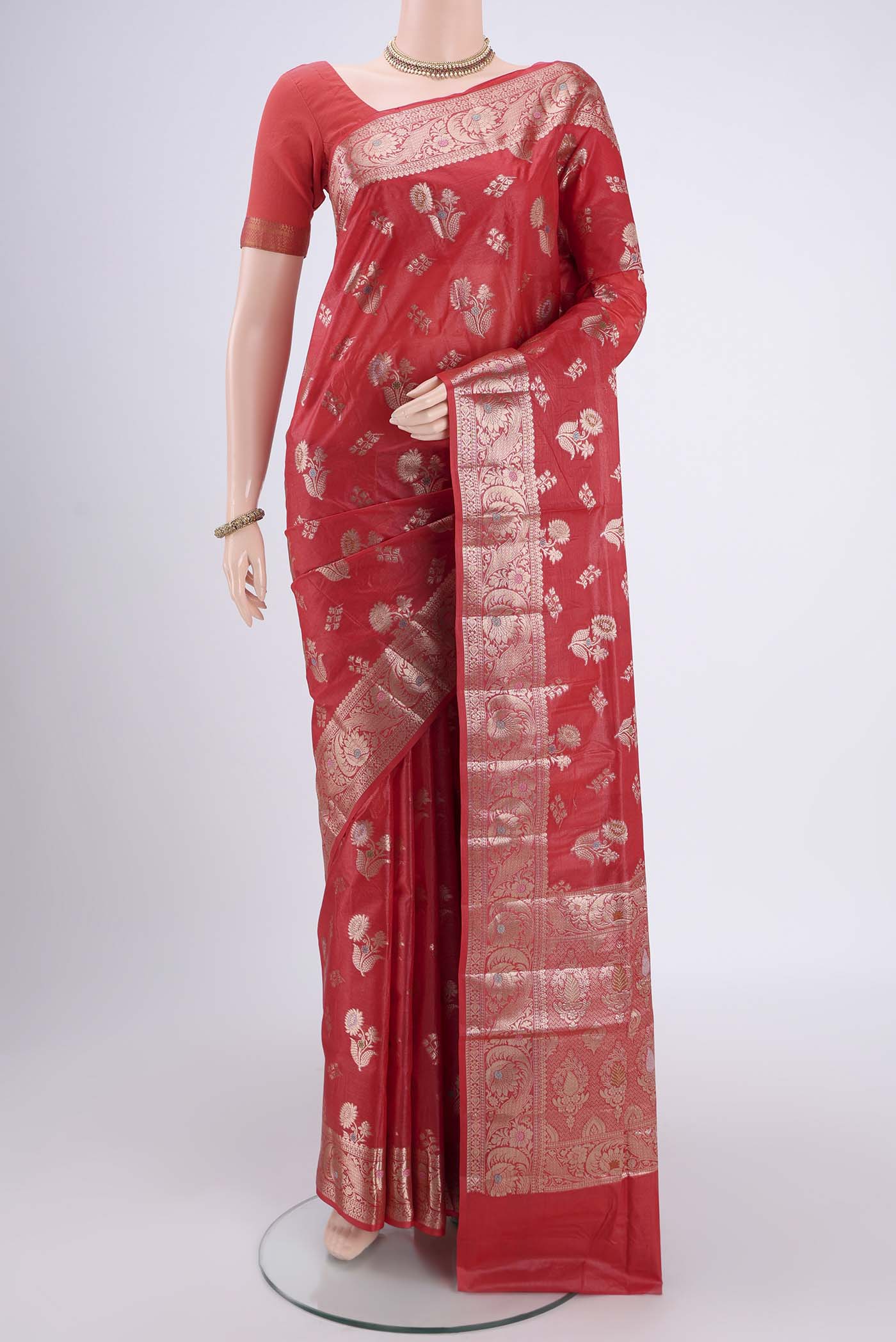 Imperial Red Banarasi Tussar Silk Saree with Zari And Thread Butta on the body and Zari And Thread Border.  displayed on a mannequin