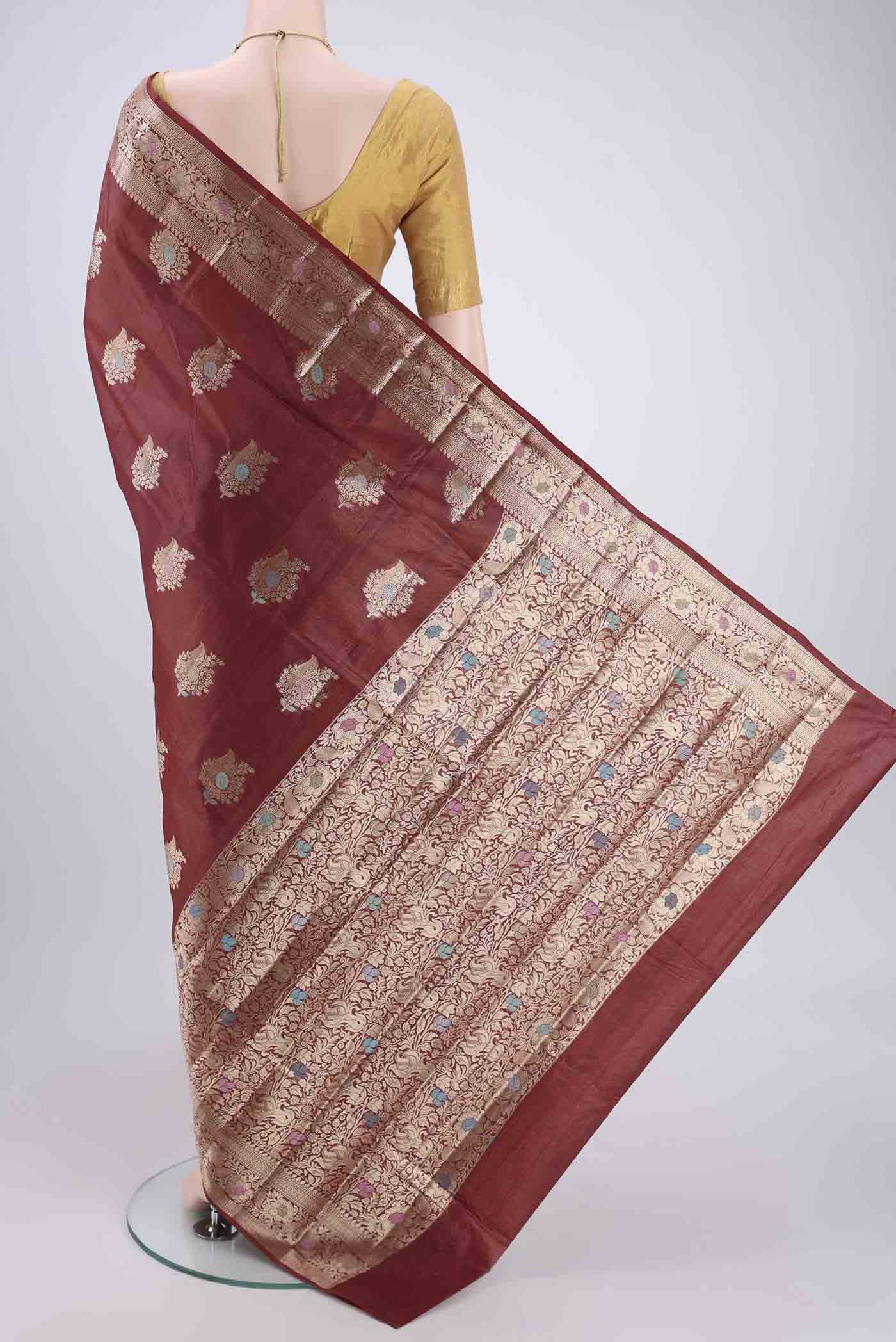 Flat view of Brown Banarasi Tussar Silk Saree with Zari And Thread Butta on the body and Zari And Thread Border. 
