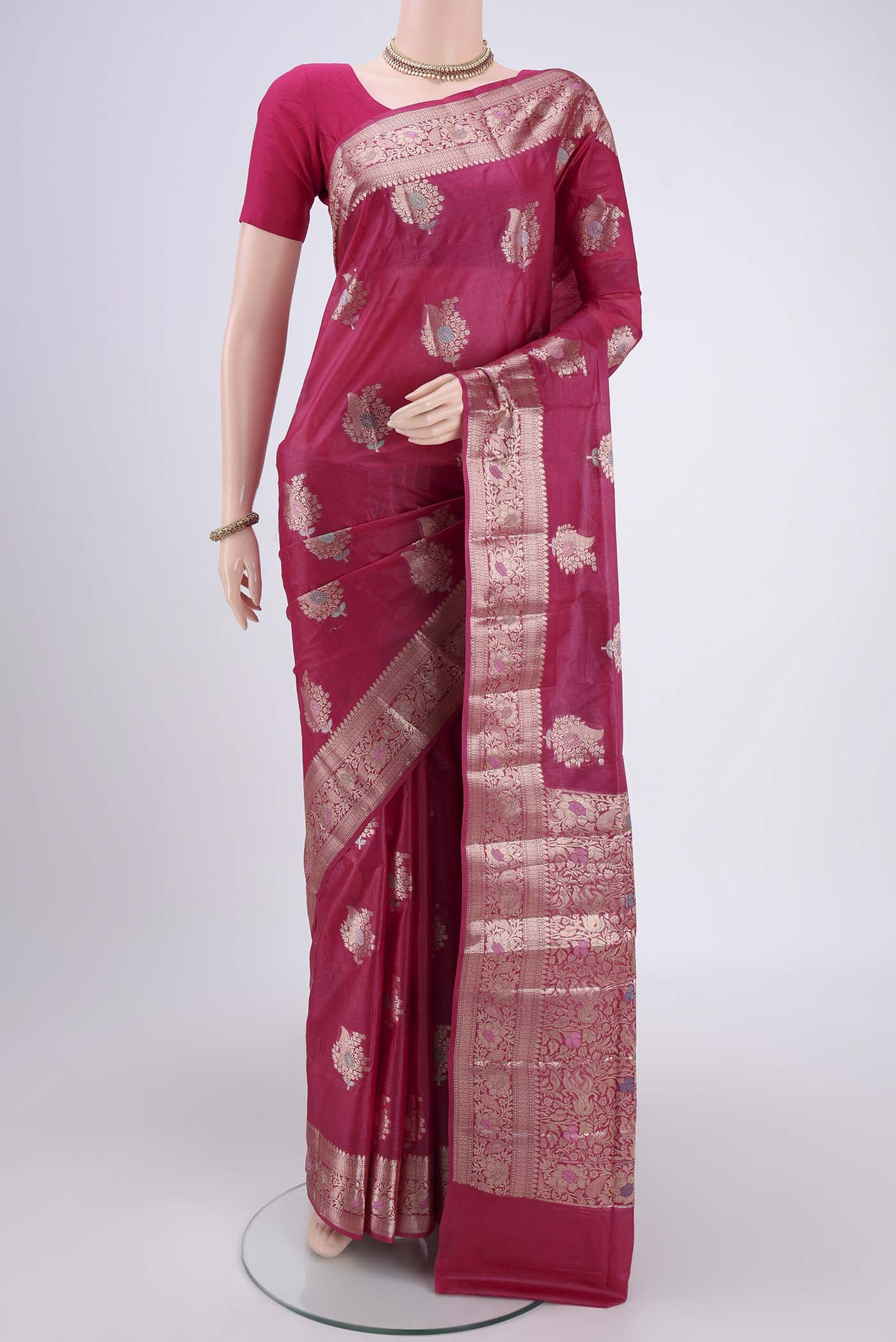 Pink Banarasi Tussar Silk Saree with Zari And Thread Butta on the body and Zari And Thread Border.  displayed on a mannequin