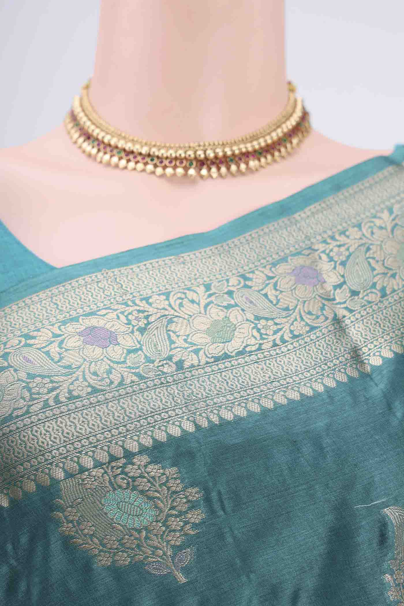 Border image of Turquoise Banarasi Tussar Silk Saree with Zari And Thread Butta on the body and Zari And Thread Border. 