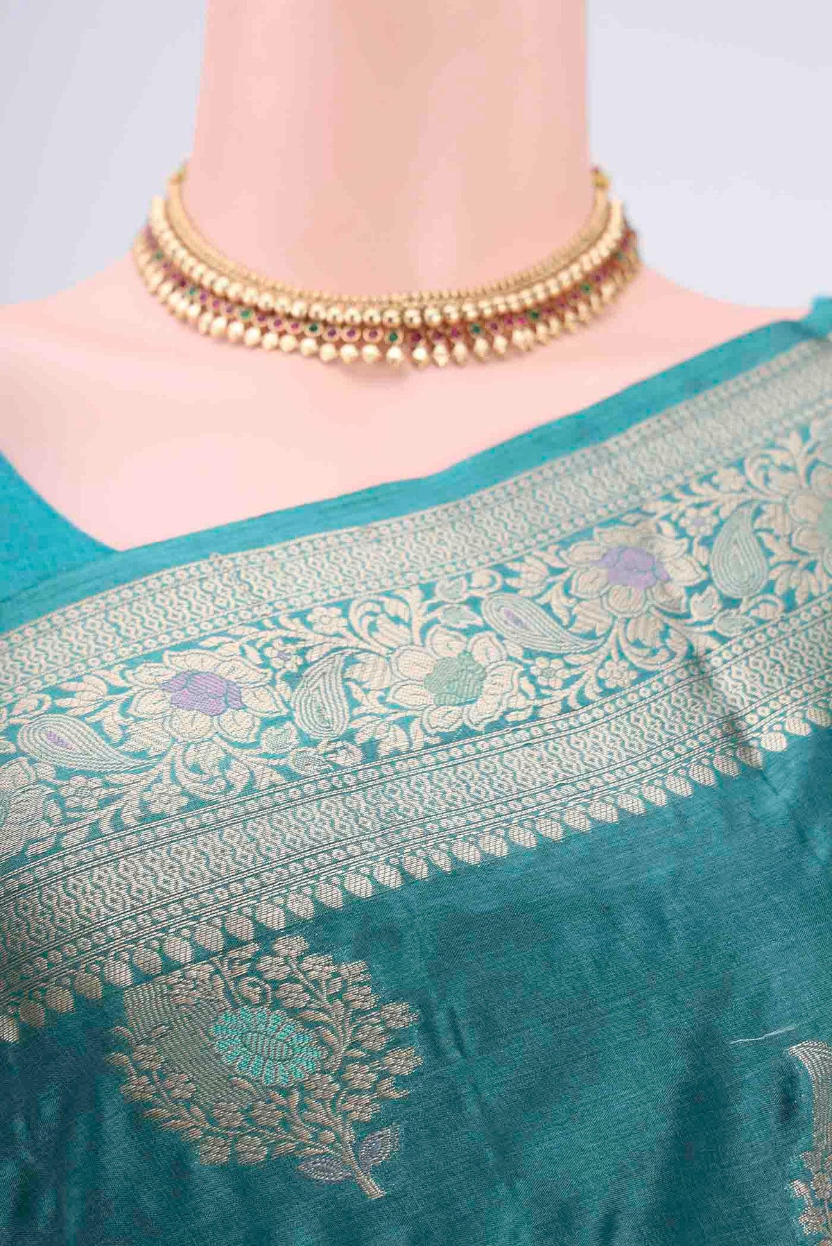 Border image of Turquoise Banarasi Tussar Silk Saree with Zari And Thread Butta on the body and Zari And Thread Border. 