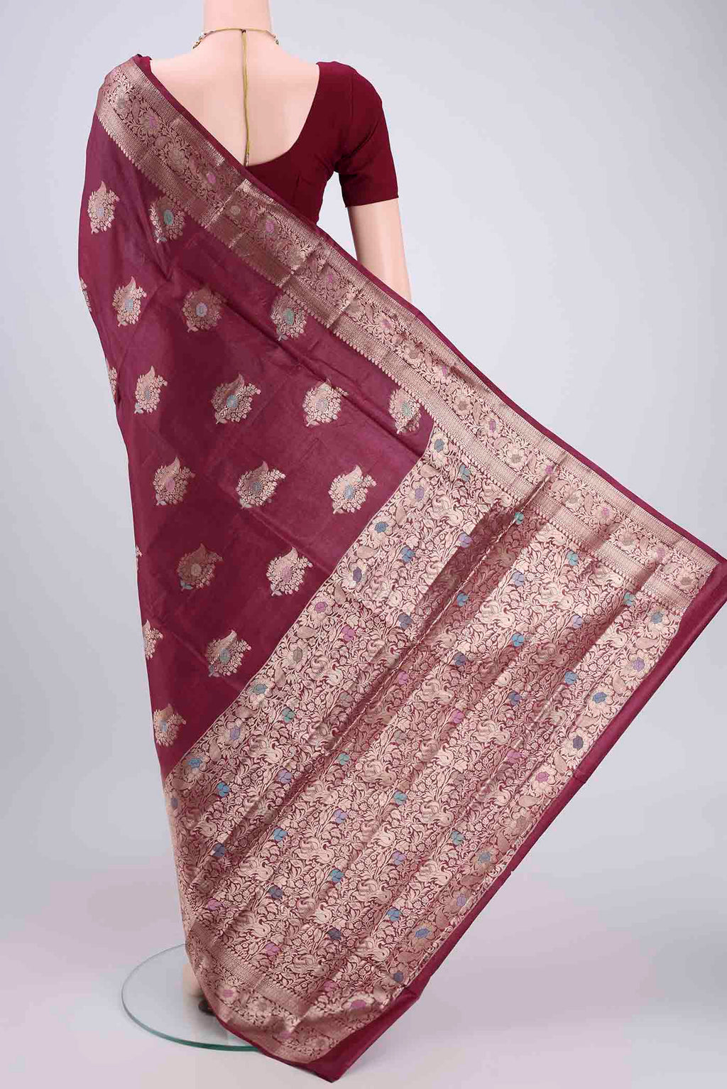 Flat view of Magenta Banarasi Tussar Silk Saree with Zari And Thread Butta on the body and Zari And Thread Border. 