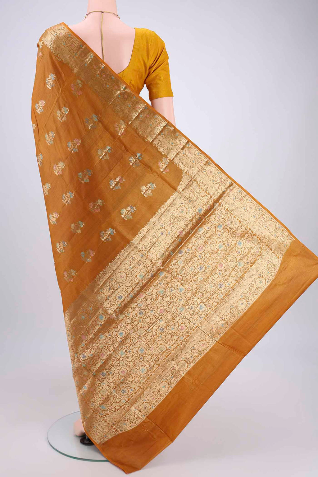 Flat view of Mustard Banarasi Tussar Silk Saree with Zari And Thread Butta on the body and Zari And Thread Border. 