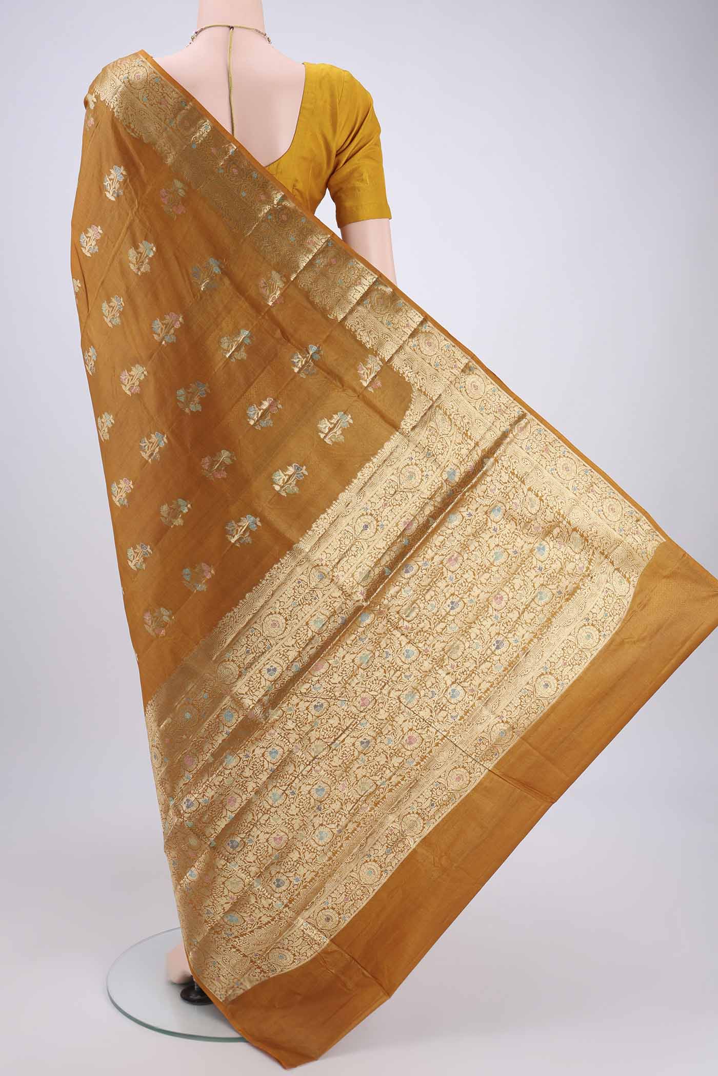 Flat view of Mustard Banarasi Tussar Silk Saree with Zari And Thread Butta on the body and Zari And Thread Border. 