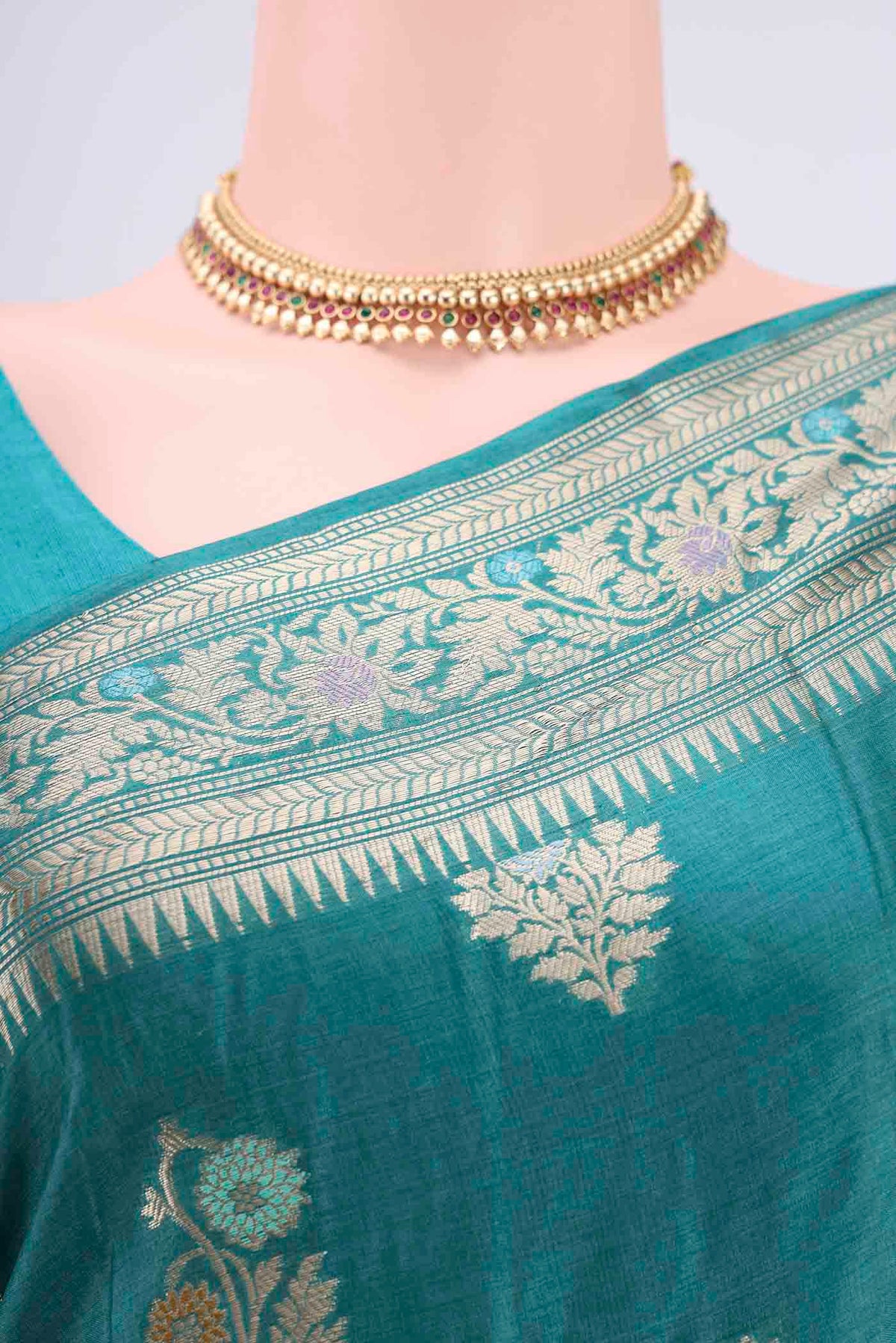 Border image of Turquoise Banarasi Tussar Silk Saree with Zari And Thread Butta on the body and Zari And Thread Border. 