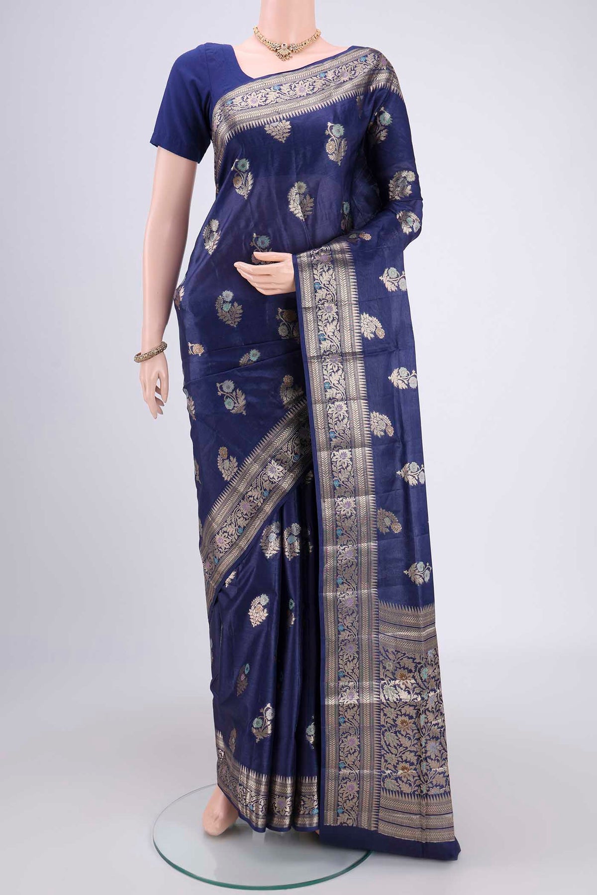 Navy Blue Banarasi Tussar Silk Saree with Zari And Thread Butta on the body and Zari And Thread Border.  displayed on a mannequin