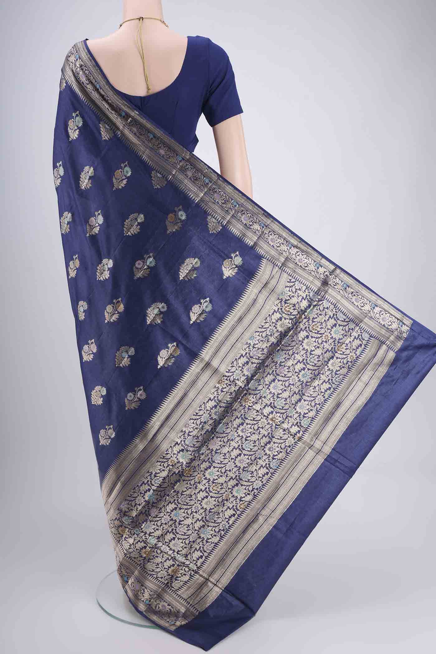 Flat view of Navy Blue Banarasi Tussar Silk Saree with Zari And Thread Butta on the body and Zari And Thread Border. 