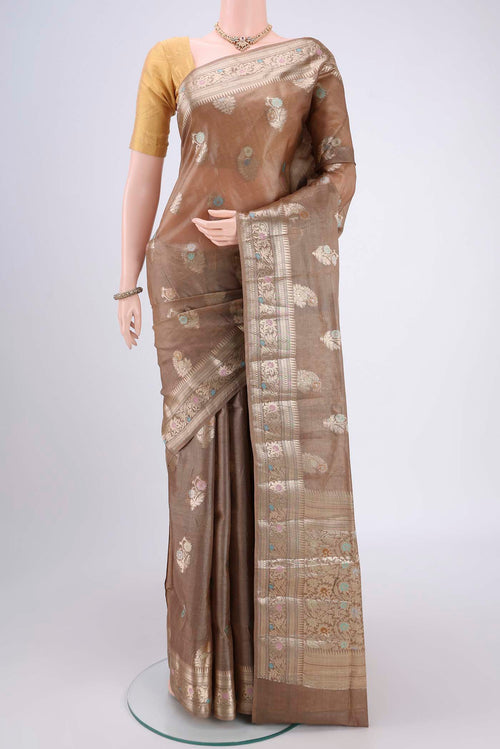 Coffee Brown Banarasi Tussar Silk Saree with Zari And Thread Butta on the body and Zari And Thread Border.  displayed on a mannequin