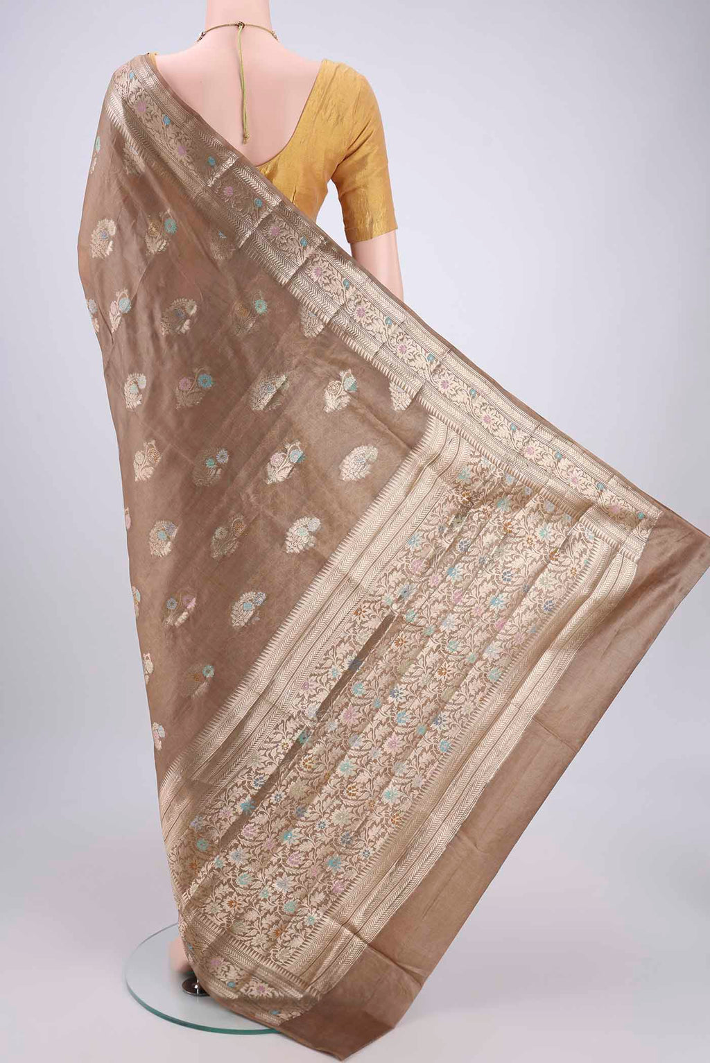 Flat view of Coffee Brown Banarasi Tussar Silk Saree with Zari And Thread Butta on the body and Zari And Thread Border. 