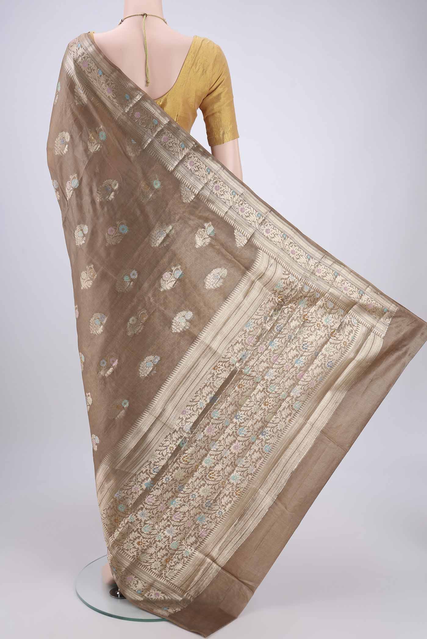 Flat view of Coffee Brown Banarasi Tussar Silk Saree with Zari And Thread Butta on the body and Zari And Thread Border. 
