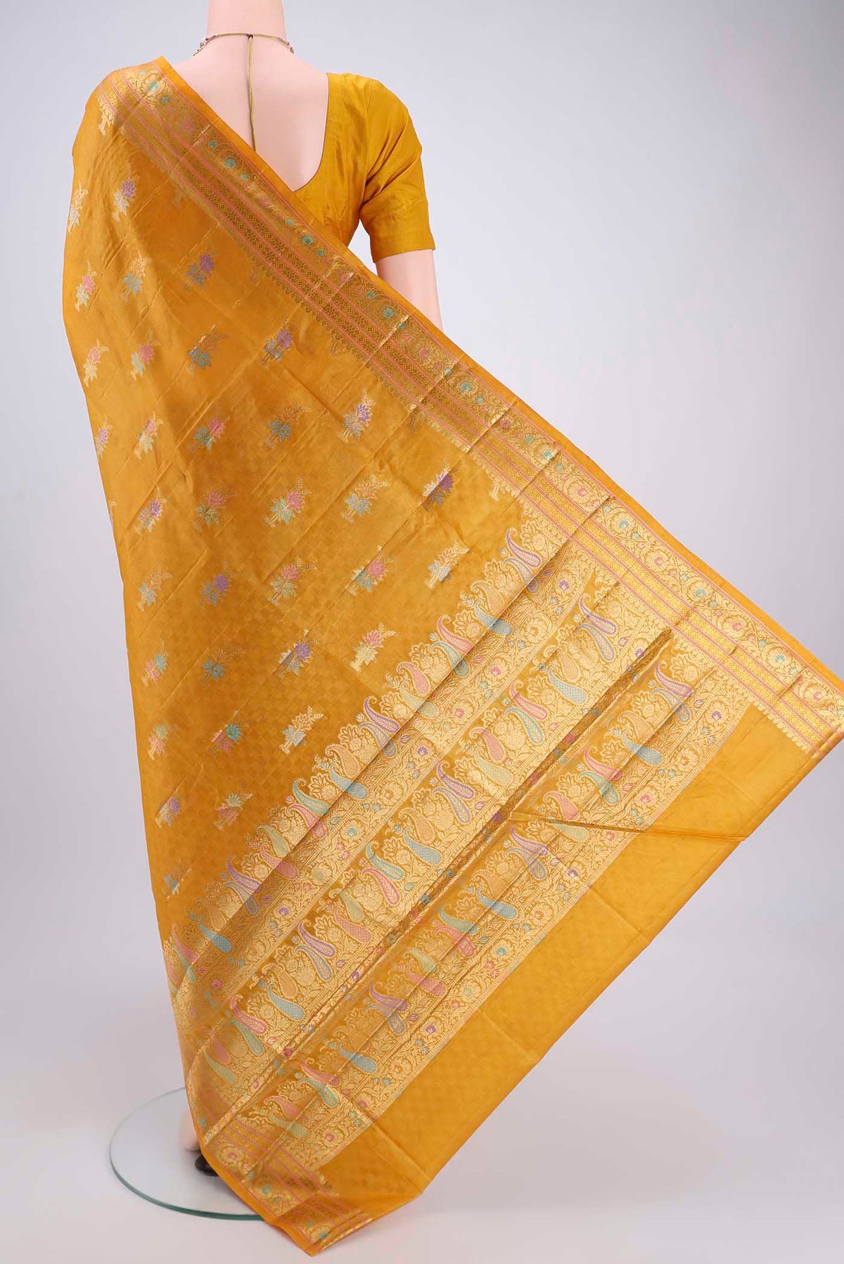 Flat view of Yellow Banarasi Tussar Silk Saree with Zari And Thread Butta on the body and Zari And Thread Border. 