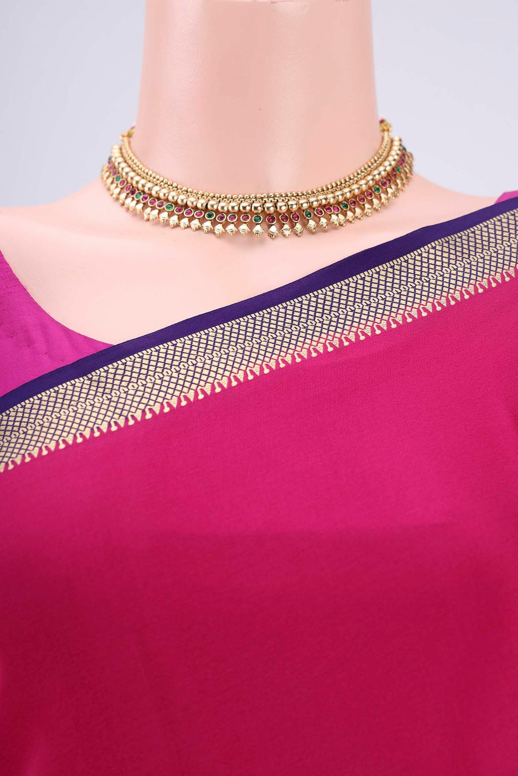 Border image of Rani Pink Mysore Crepe Saree with Plain Body and Zari Border. 