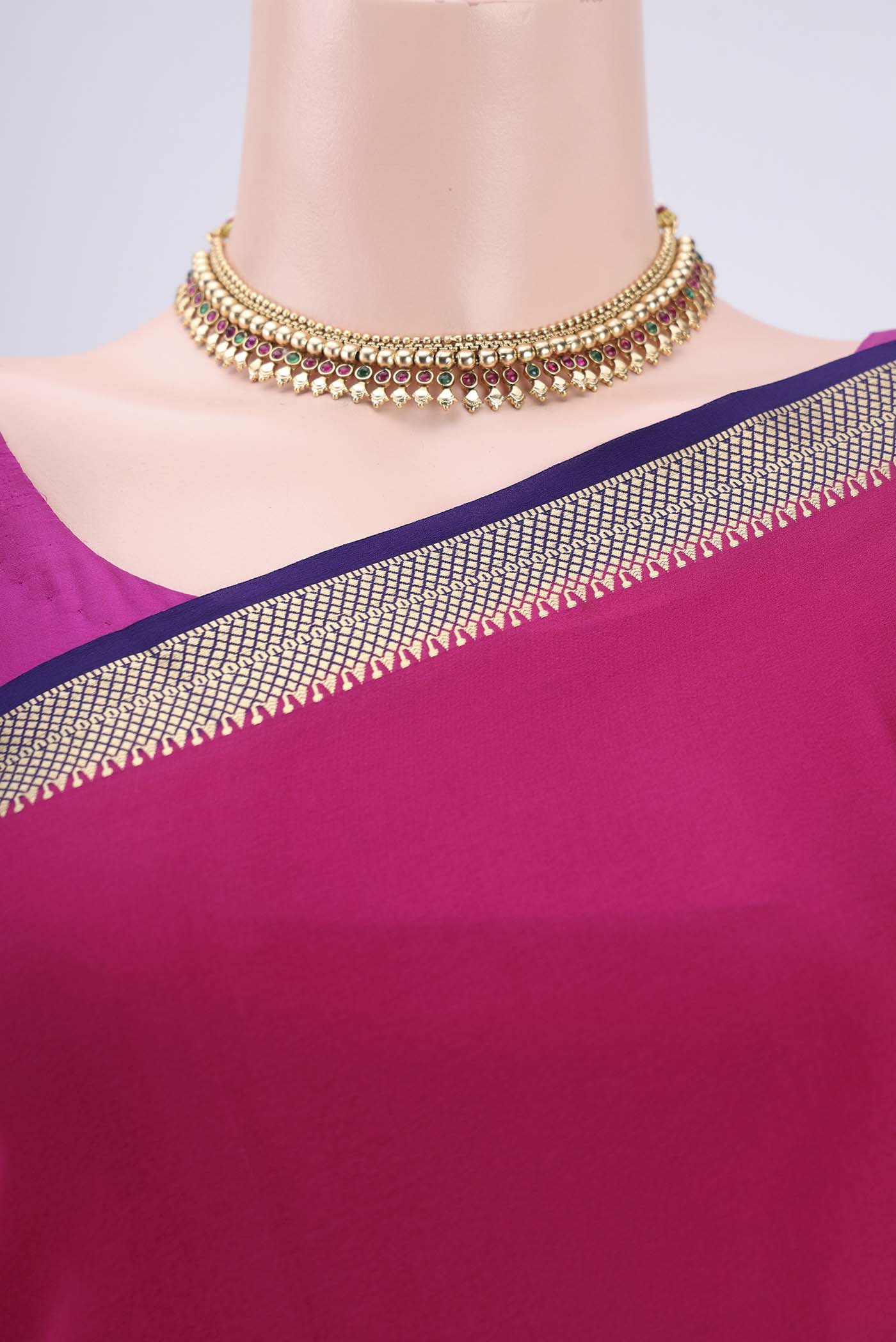 Border image of Rani Pink Mysore Crepe Saree with Plain Body and Zari Border. 