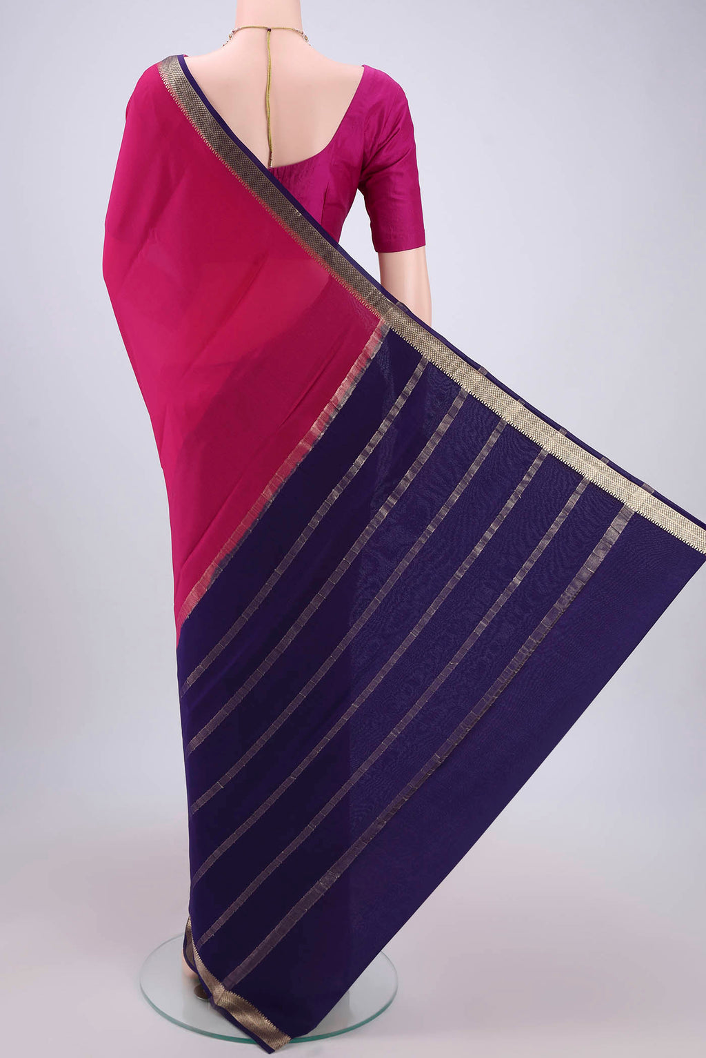 Flat view of Rani Pink Mysore Crepe Saree with Plain Body and Zari Border. 