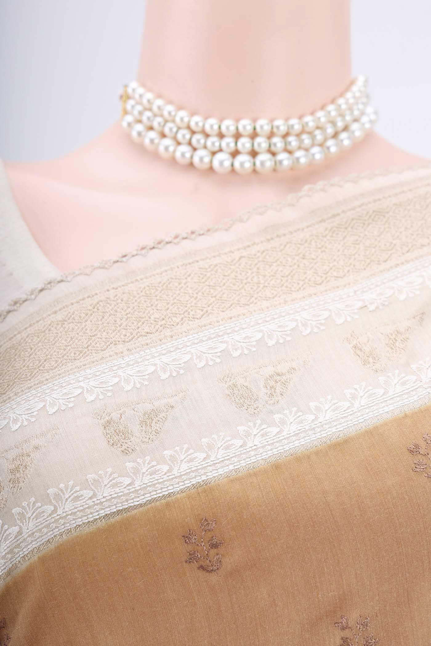 Border image of Dark Beige Tussar Silk Saree with Thread Butta on the body and Zari Border. 