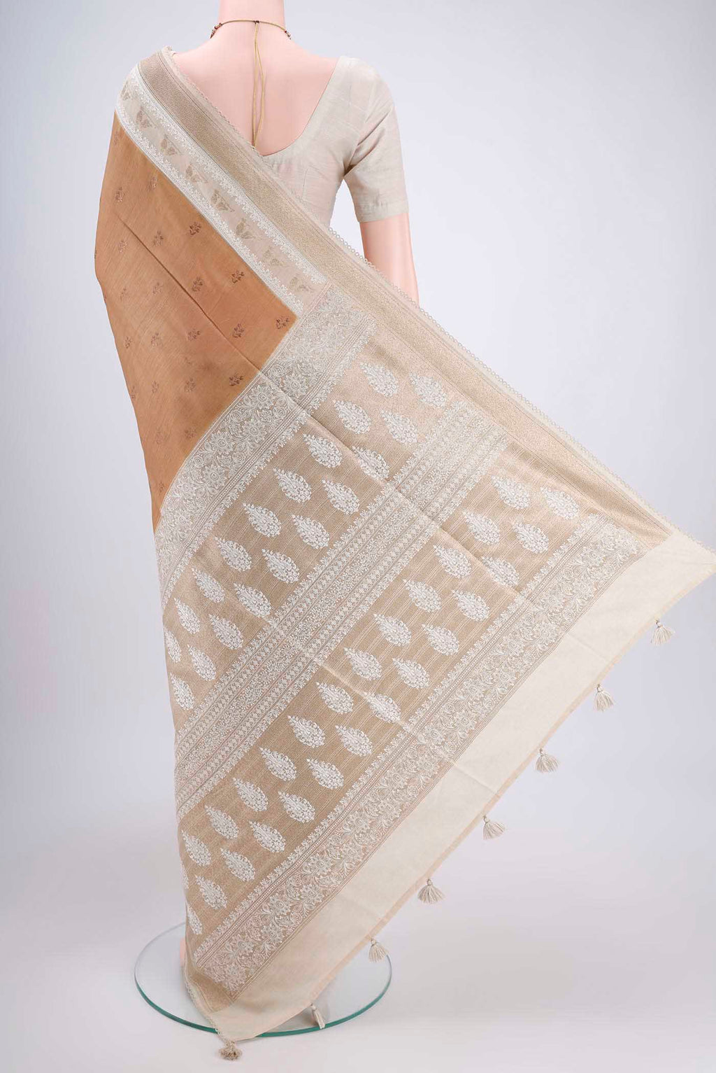 Flat view of Dark Beige Tussar Silk Saree with Thread Butta on the body and Zari Border. 