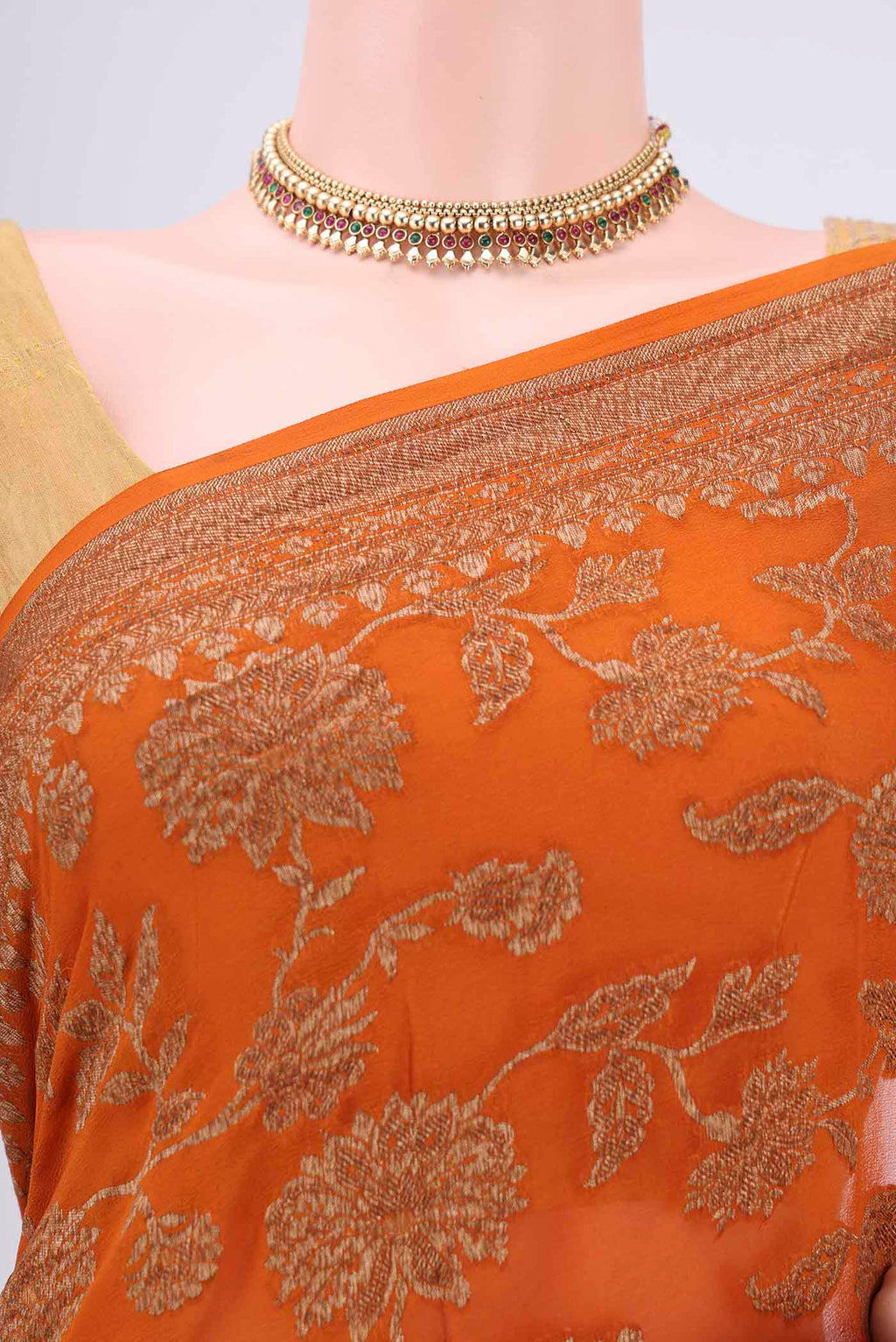 Border image of Rust Banarasi Georgette Saree with Zari Brocade on the body and Zari Border. 